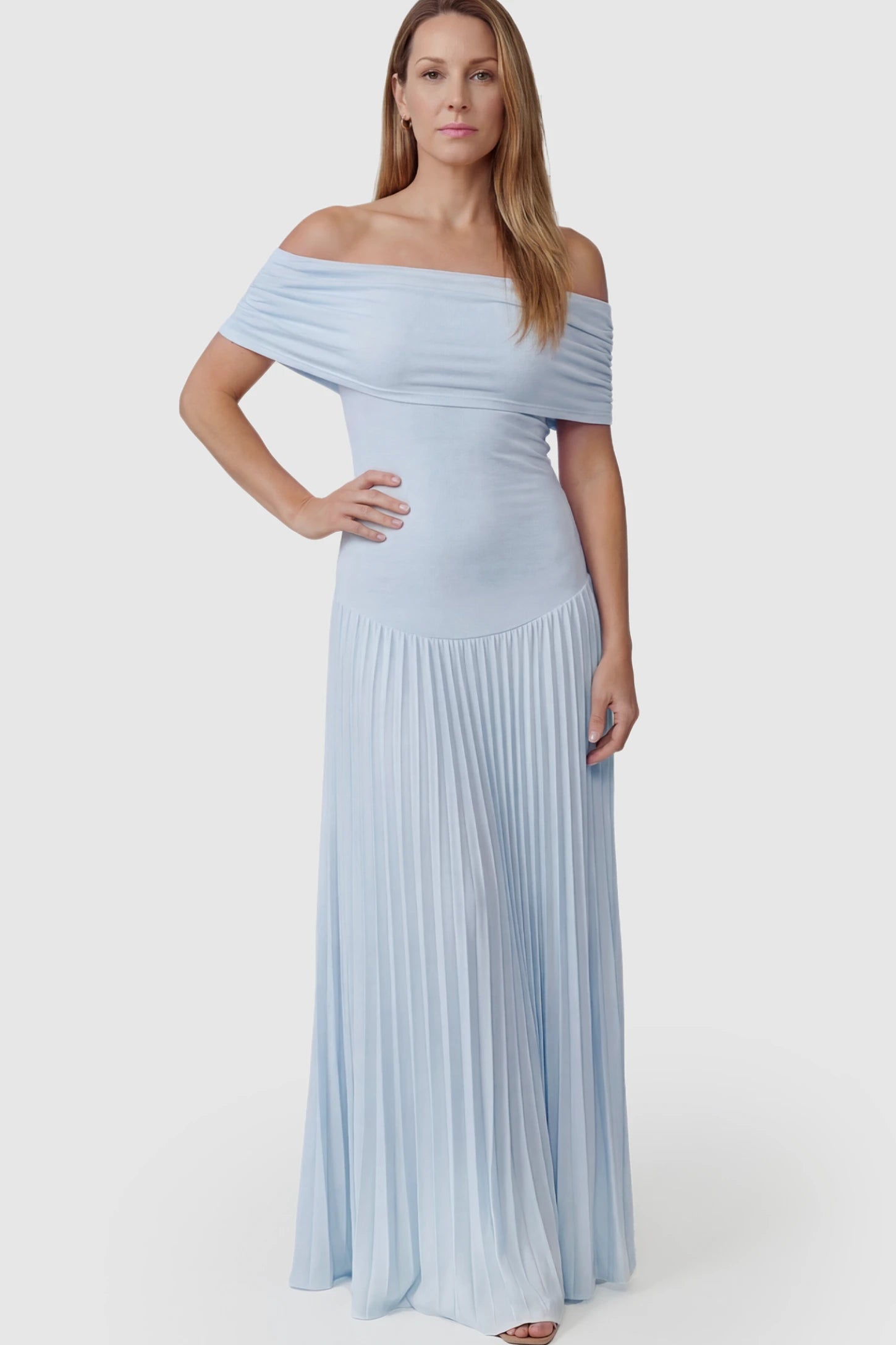 Pleated Off Shoulder Maternity Maxi Dress Pleated Off Shoulder Maternity Maxi Dress in Light Blue featuring a floor-length silhouette on a postpartum model.