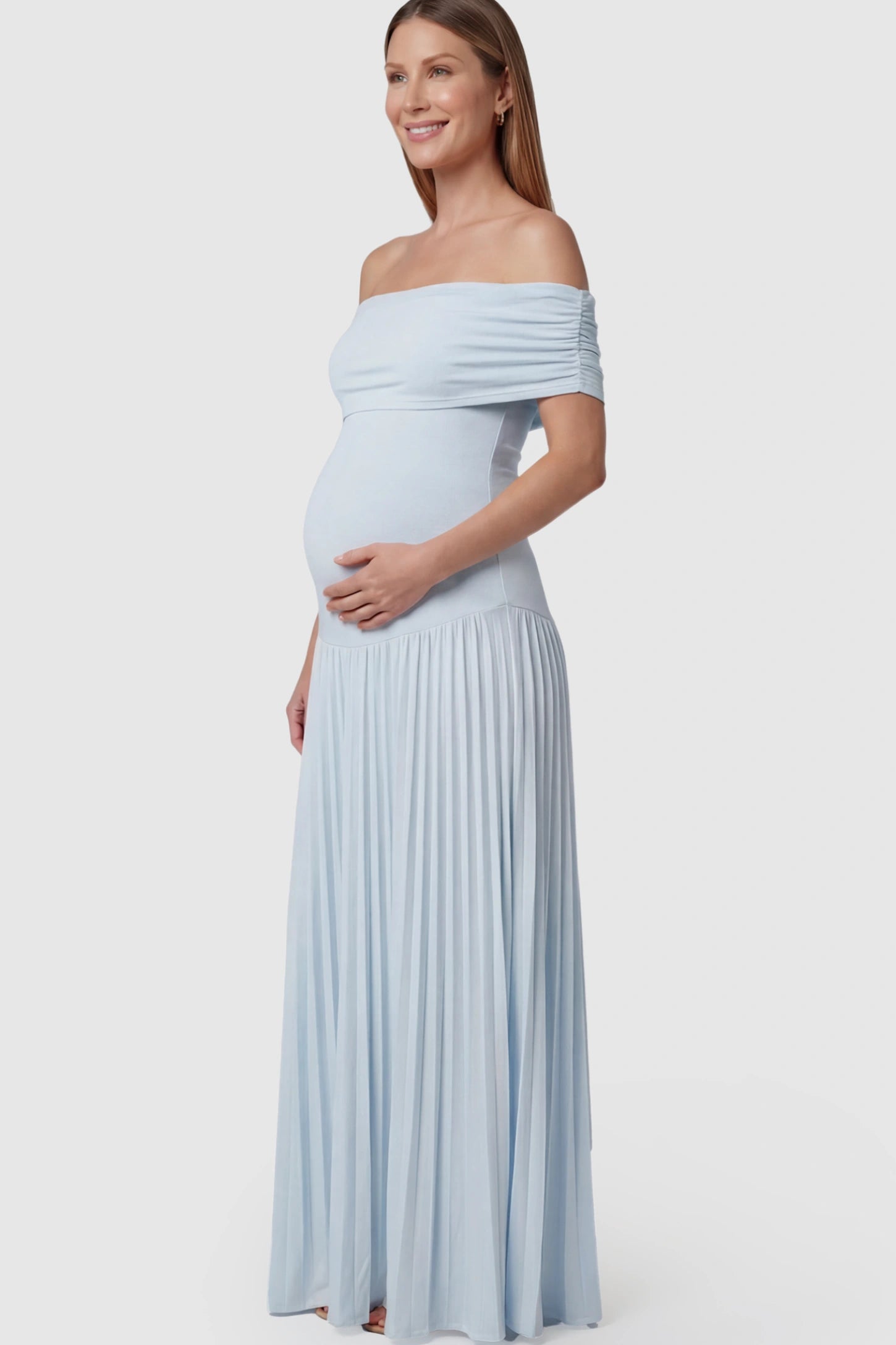 Pleated Off Shoulder Maternity Maxi Dress Pleated Off Shoulder Maternity Maxi Dress in Light Blue featuring a floor-length silhouette on a pregnant model.