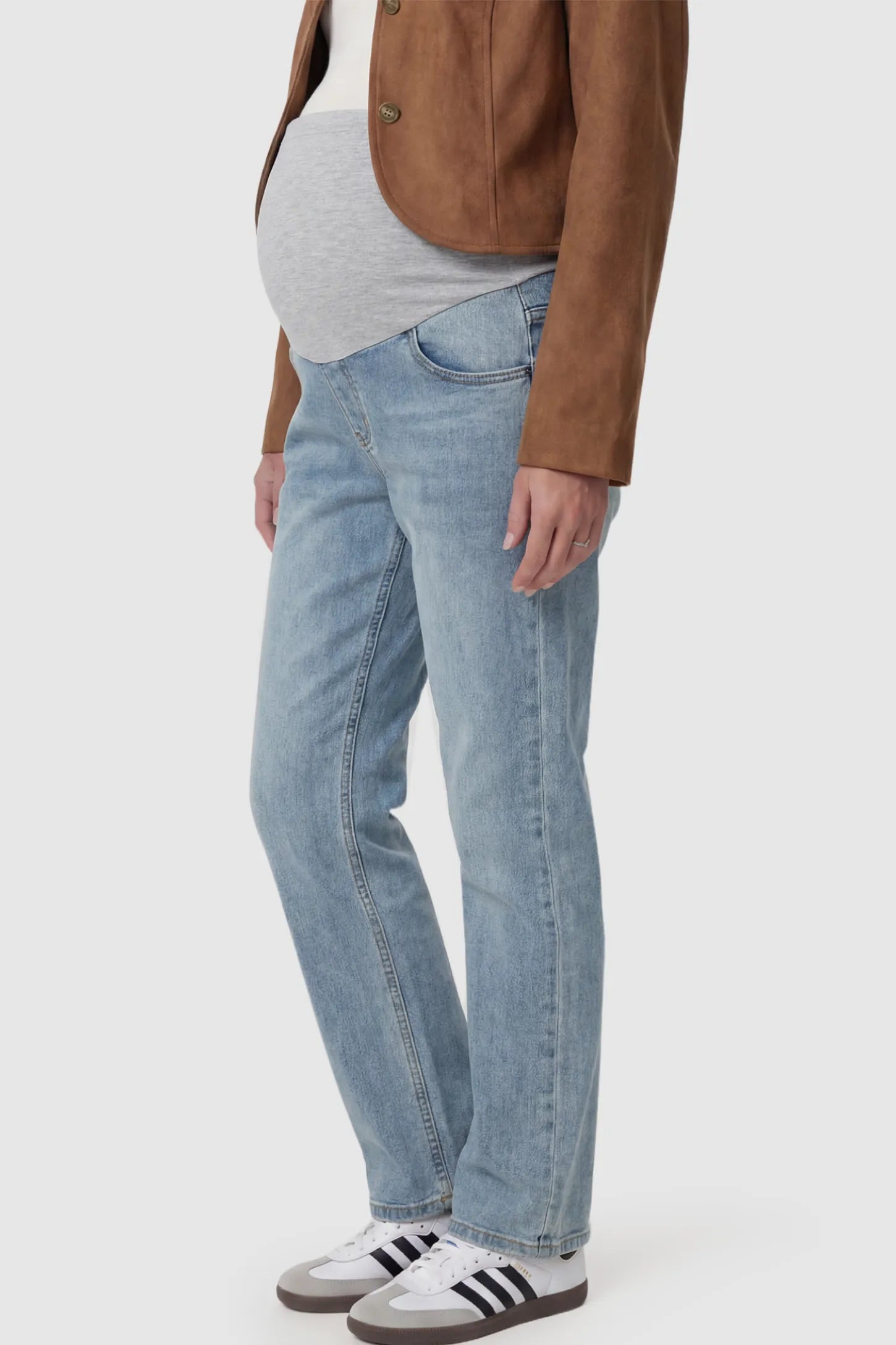 Full Panel Stretch Waistband Straight Leg Maternity Jeans Full Panel Straight Leg Maternity Jeans in light Blue featuring a stretch waistband on a pregnant model showing side.