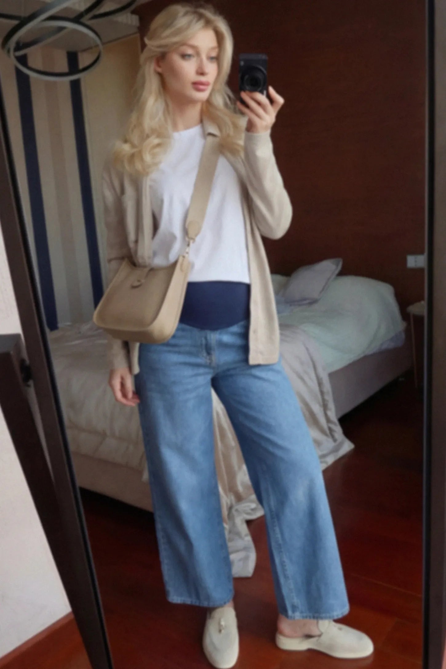 Raw Hem Full Panel Wide Leg Maternity Jeans Raw Hem Full Panel Wide Leg Maternity Jeans in dark blue featuring a high-rise navy belly band on a pregnant woman.