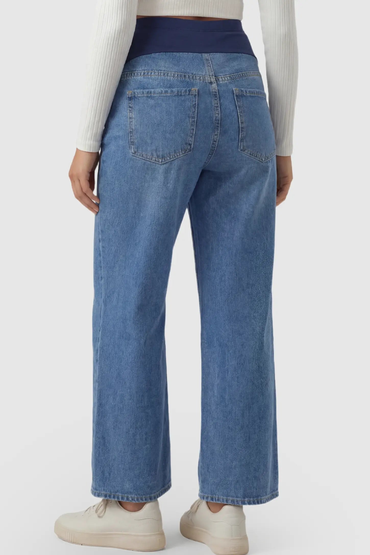 Raw Hem Full Panel Wide Leg Maternity Jeans Raw Hem Full Panel Wide Leg Maternity Jeans in dark blue featuring a high-rise navy belly band on a pregnant model.