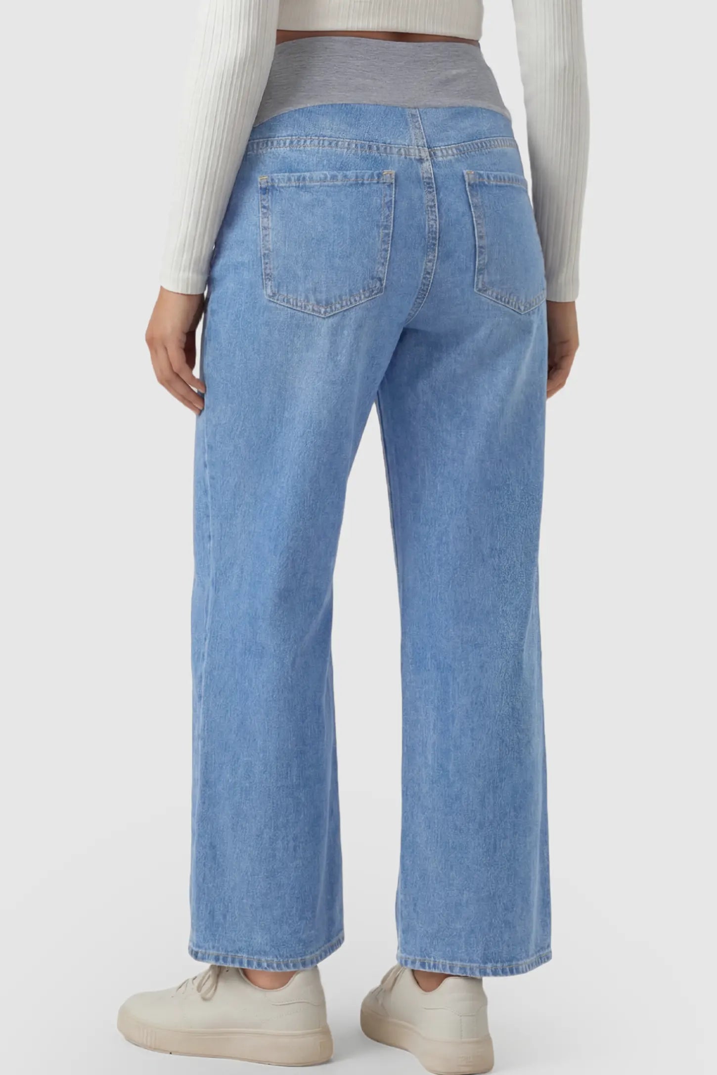Raw Hem Full Panel Wide Leg Maternity Jeans Raw Hem Full Panel Wide Leg Maternity Jeans in light blue featuring a high-rise belly band on a pregnant model.