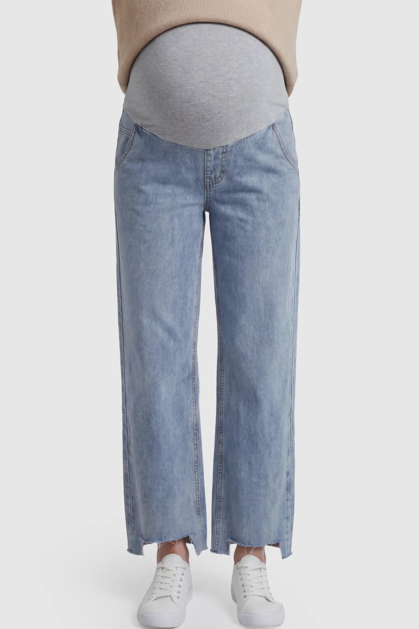 Raw Hem Wide Leg Maternity Jeans in Light Blue Denim with a grey over-the-belly comfort panel and raw hem on a pregnant model.