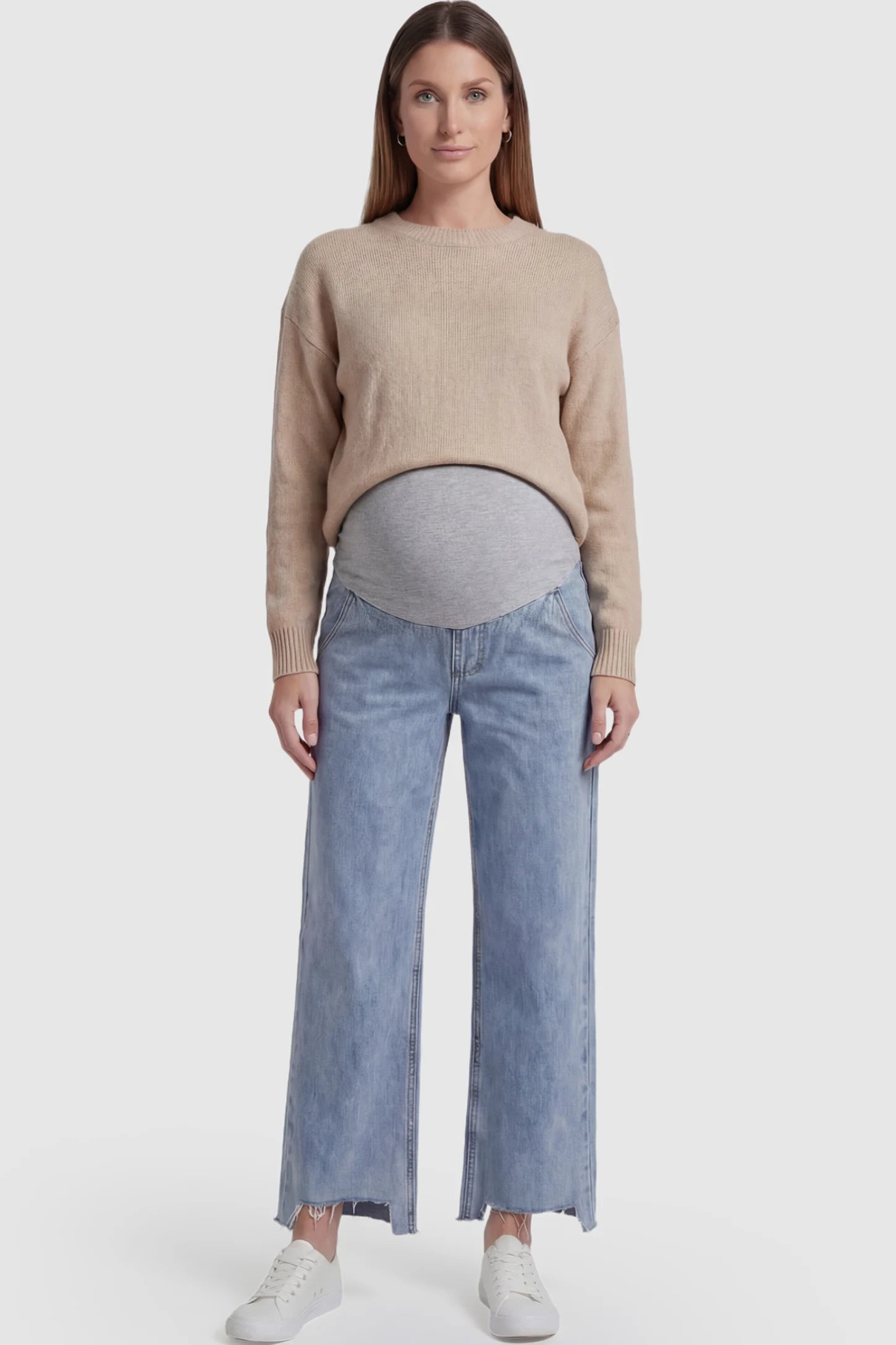 Raw Hem Wide Leg Maternity Jeans in Light Blue Denim with a grey over-the-belly comfort panel and raw hem on a pregnant model.