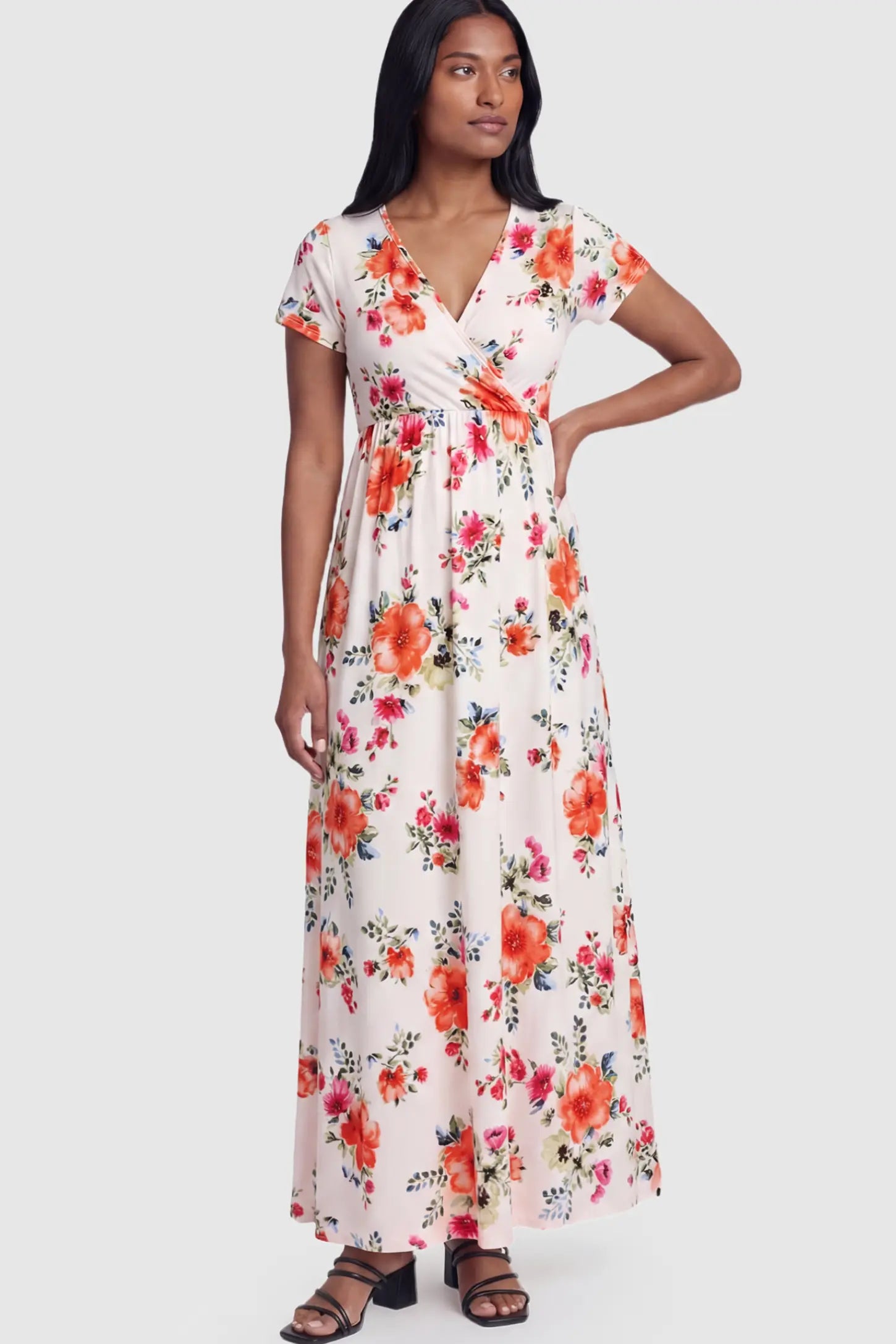 Floral Print V-Neck Maternity Maxi Dress Floral Print V-Neck Maternity Maxi Dress in White featuring a vibrant floral pattern on a postpartum model.