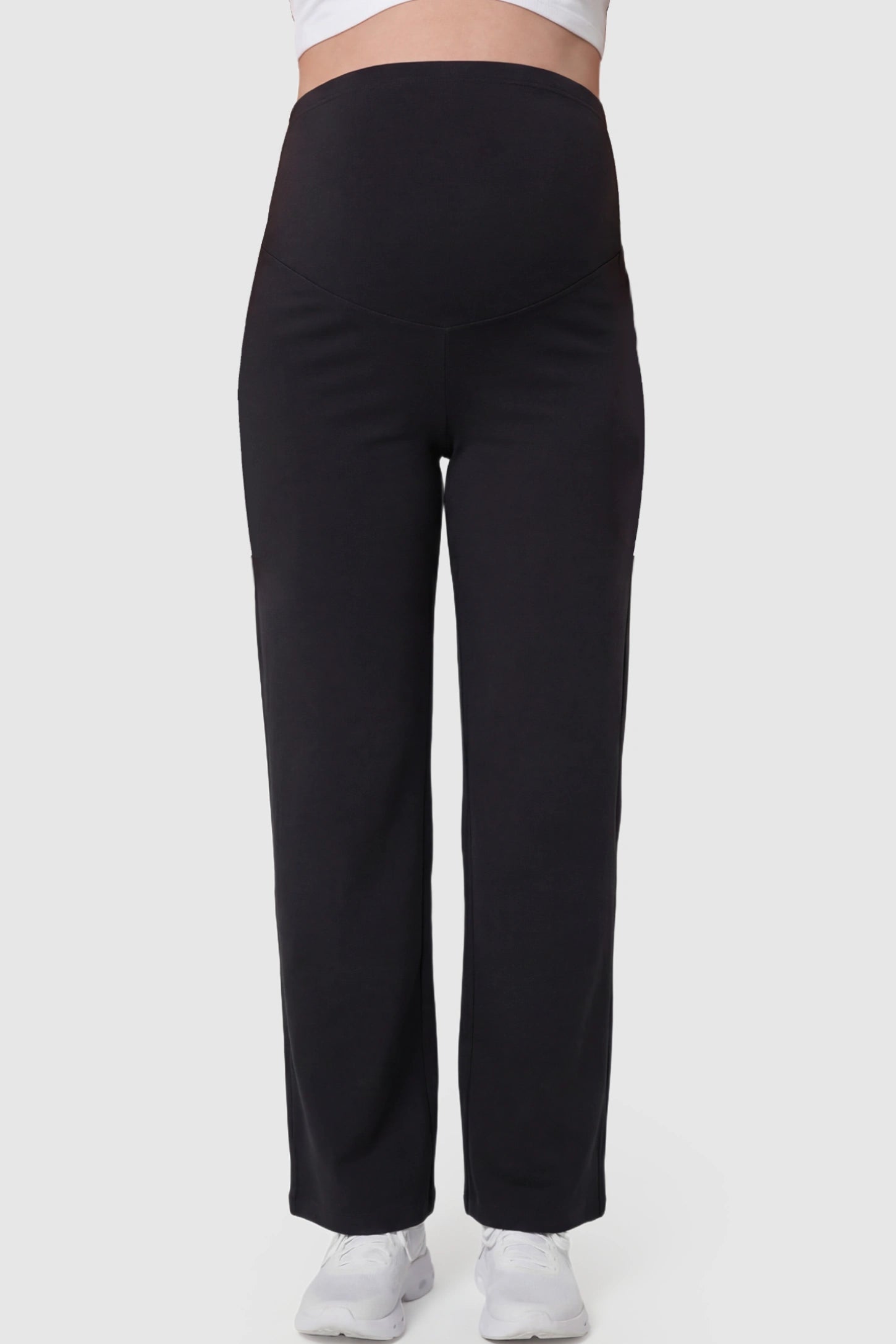 High Waisted Full Panel Wide Leg Maternity Pants in Black featuring a stretch waistband on a pregnant model.
