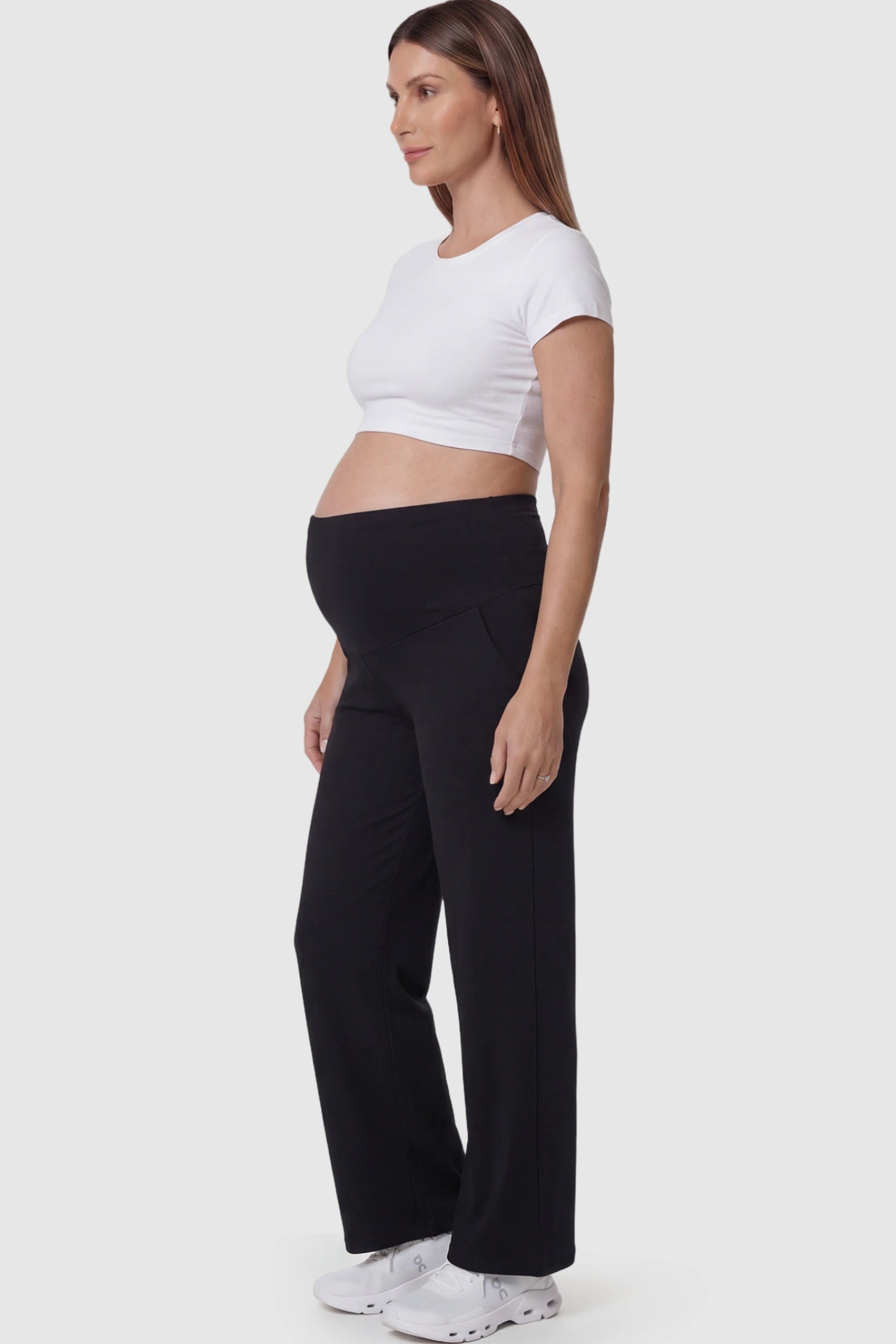 High Waisted Full Panel Wide Leg Maternity Pants in Black featuring a stretch waistband on a pregnant model.