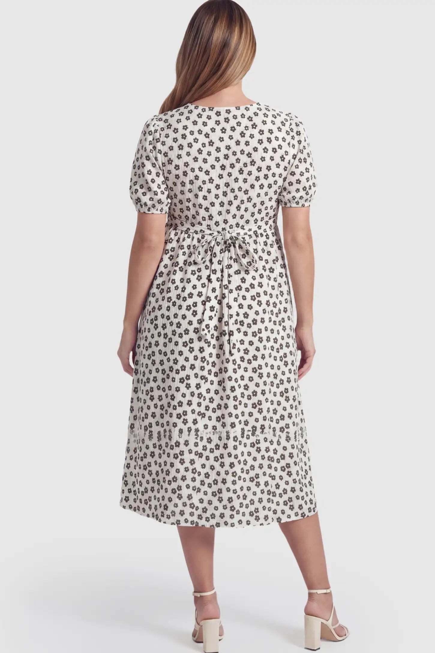 Floral V-Neck Short Sleeve Maternity Nursing Dress Floral Print V-Neck Maternity Nursing Dress in Black on a pregnant model.