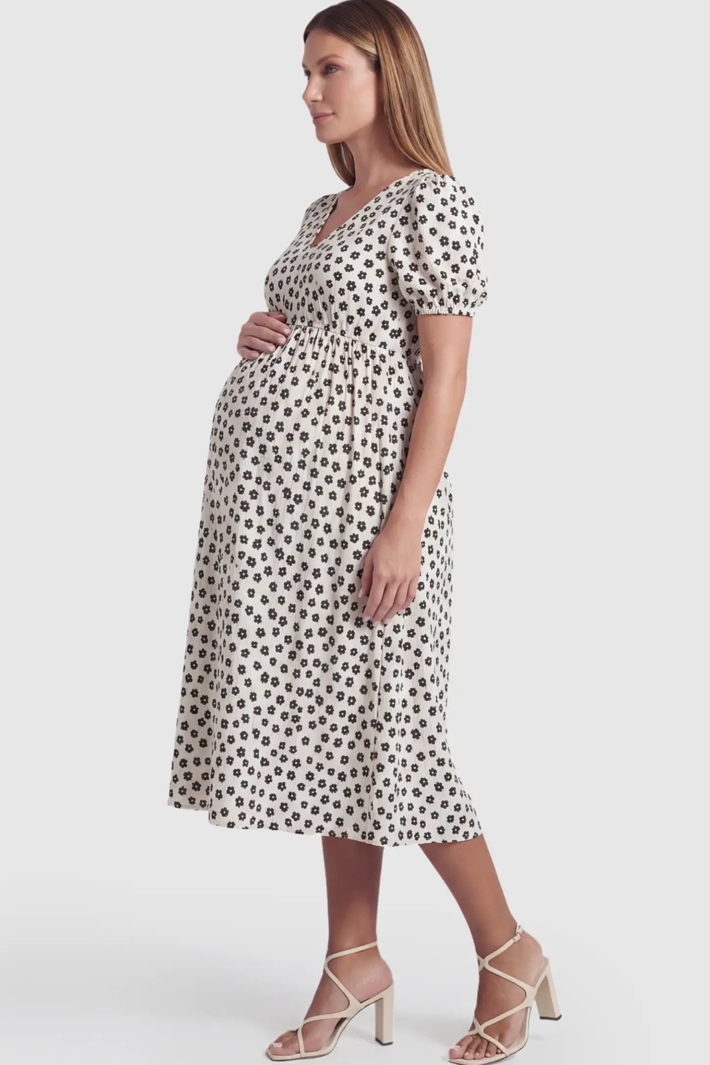 Floral V-Neck Short Sleeve Maternity Nursing Dress Floral Print V-Neck Maternity Nursing Dress in Black featuring functional button-front details on a pregnant model.