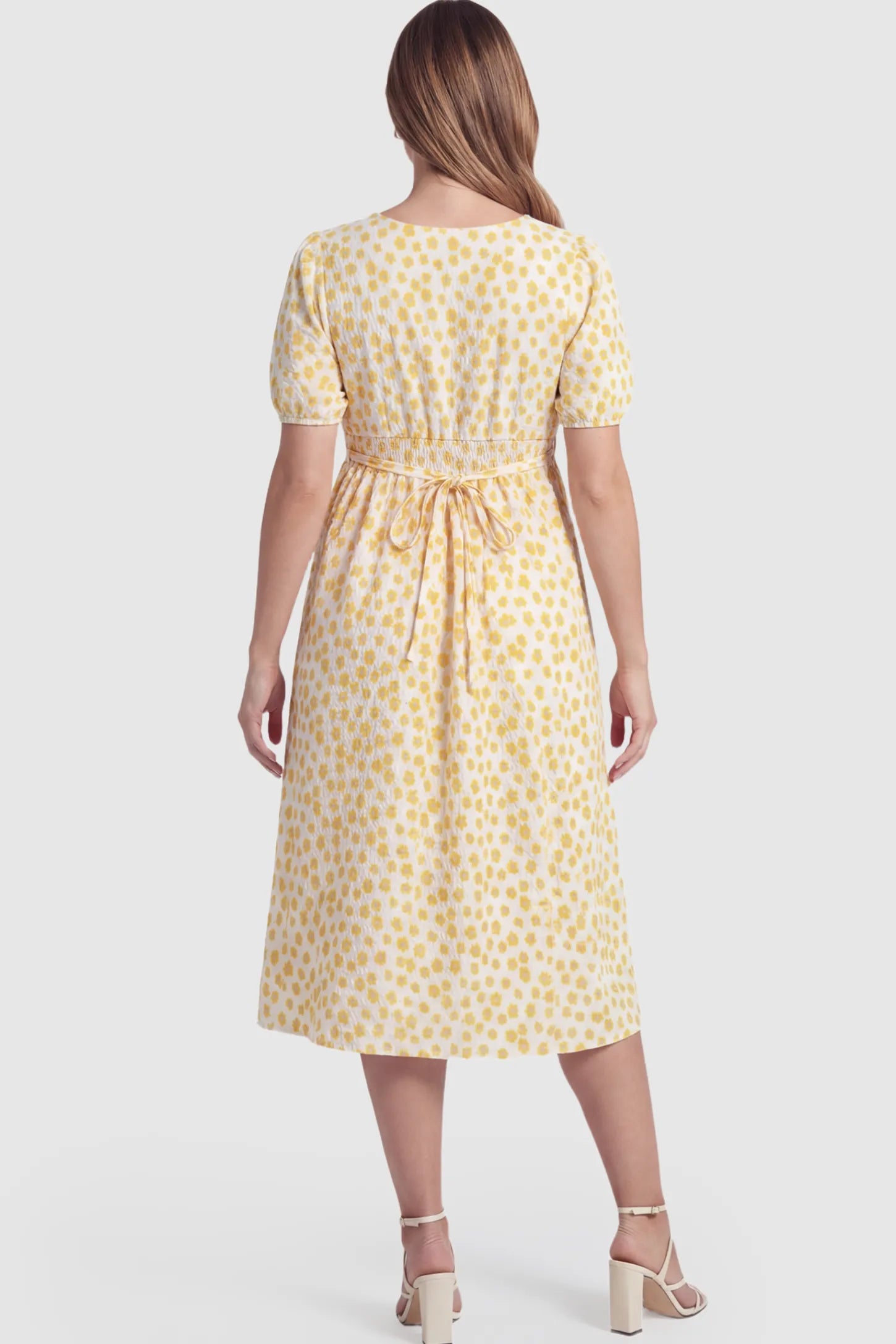 Floral V-Neck Short Sleeve Maternity Nursing Dress Floral Print V-Neck Maternity Nursing Dress in Yellow on a pregnant model.