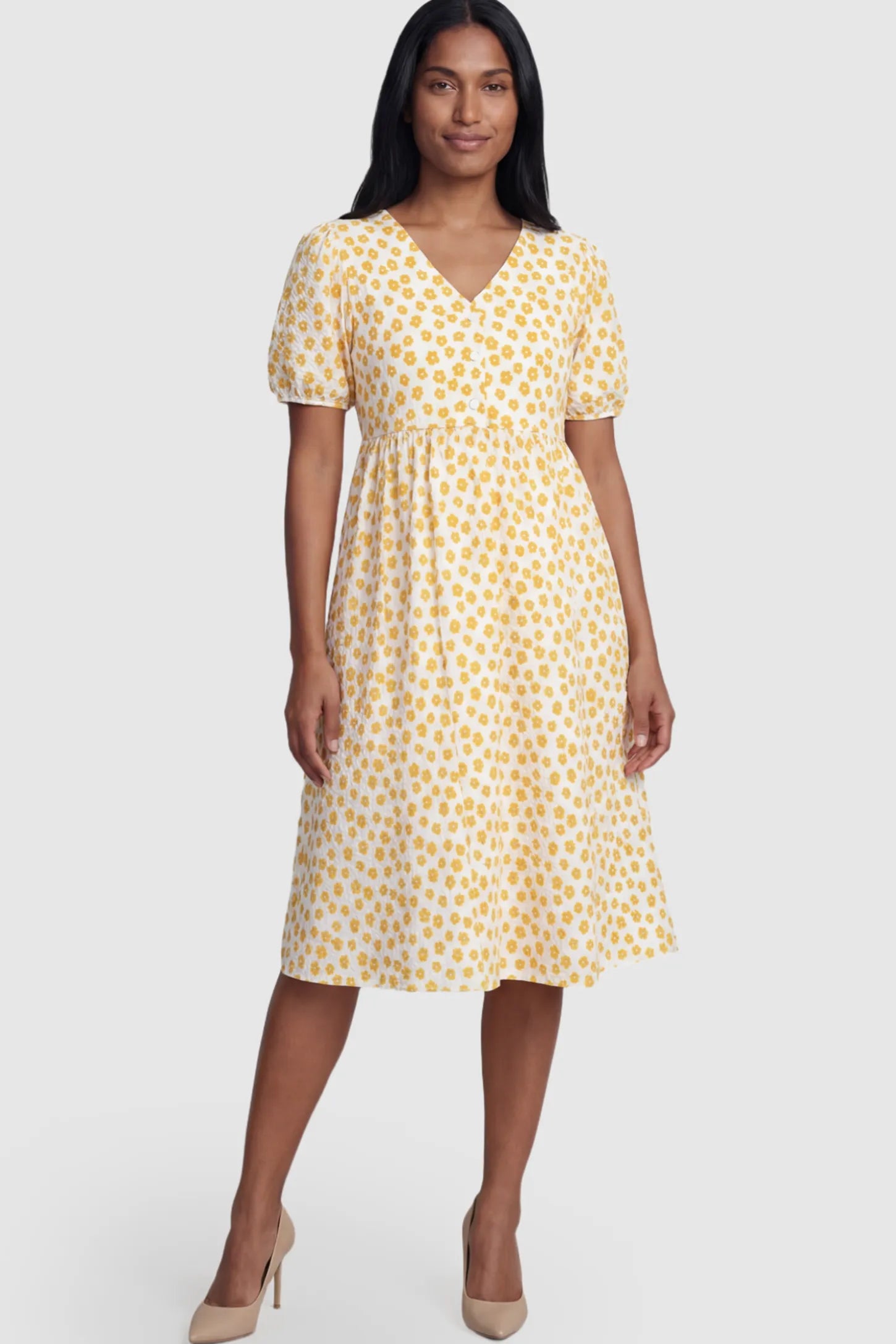Floral V-Neck Short Sleeve Maternity Nursing Dress Floral Print V-Neck Maternity Nursing Dress in Yellow featuring functional button-front details on a postpartum model.