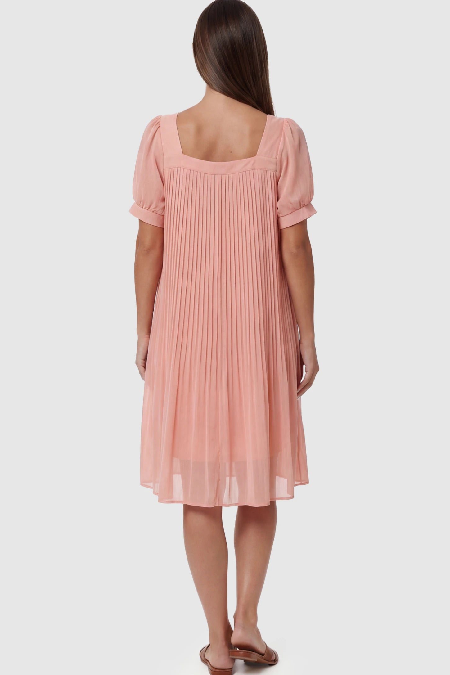 Pleated Front Square Neck Maternity Dress Pleated Front Square Neck Maternity Dress in Pink featuring accordion pleats and short sleeves on a pregnant model.