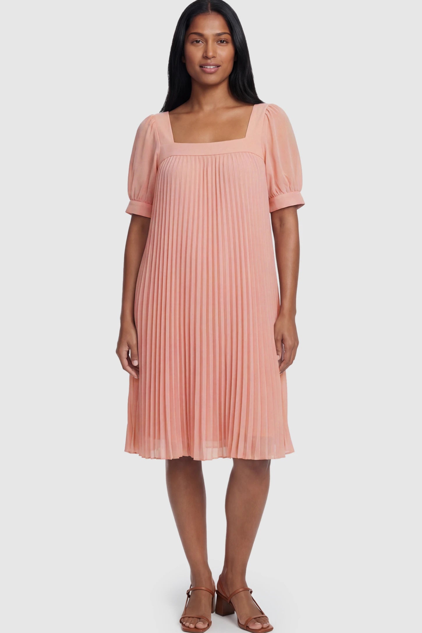 Pleated Front Square Neck Maternity Dress Pleated Front Square Neck Maternity Dress in Pink featuring accordion pleats and short sleeves on a postpartum model.