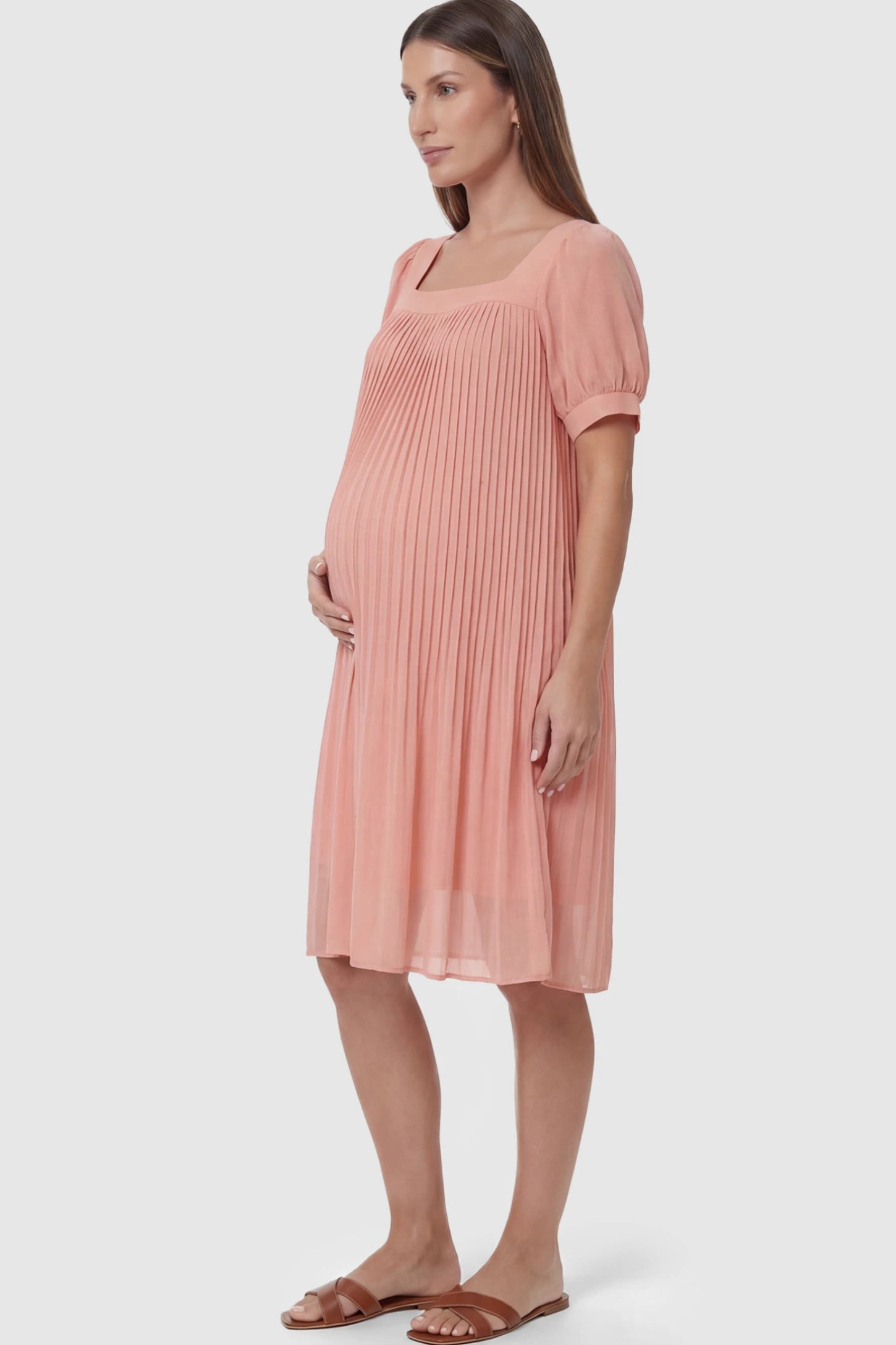 Pleated Front Square Neck Maternity Dress in Pink featuring accordion pleats and short sleeves on a pregnant model.
