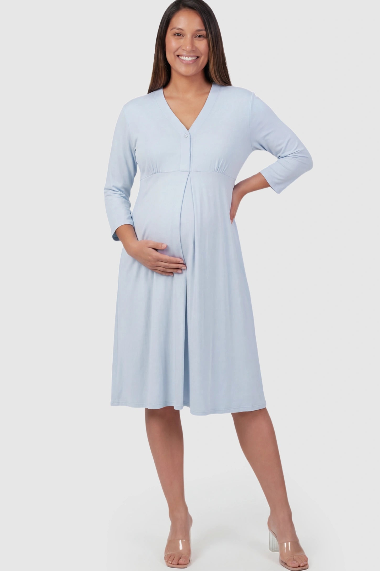 Pure Cotton V-Neck Button Front Maternity Nursing Dress Pure Cotton V-Neck Button Front Maternity Nursing Dress in Light Blue on a pregnant model.