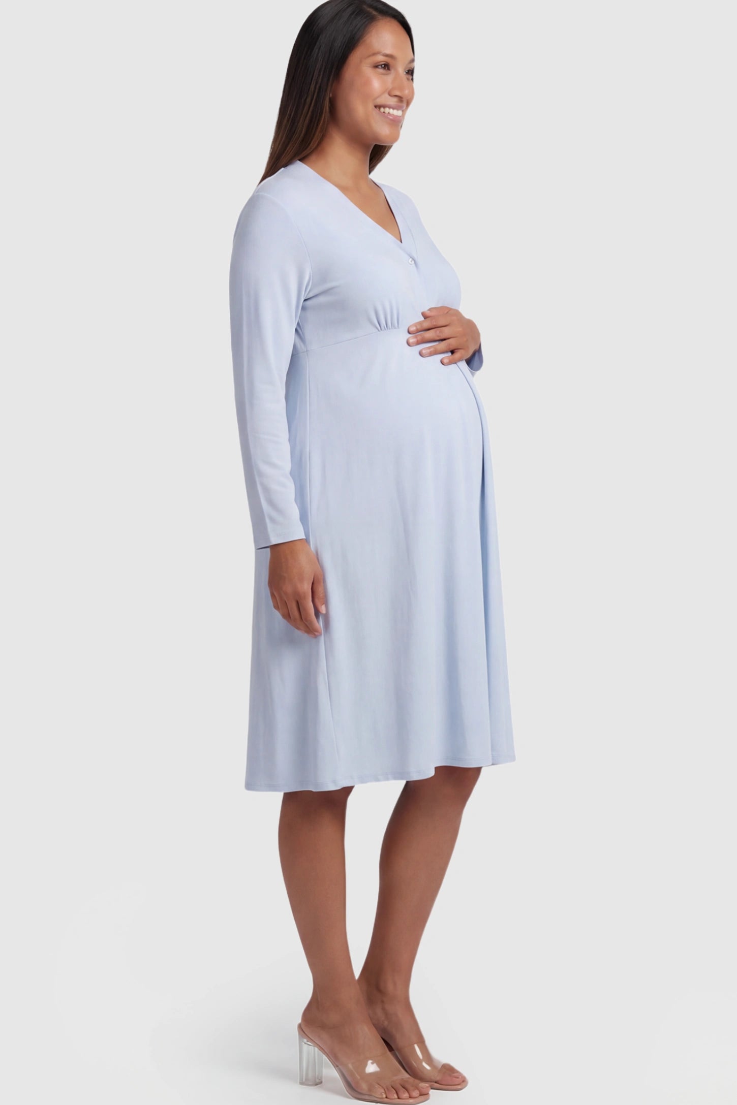 Pure Cotton V-Neck Button Front Maternity Nursing Dress Pure Cotton V-Neck Button Front Maternity Nursing Dress in Light Blue on a pregnant model.