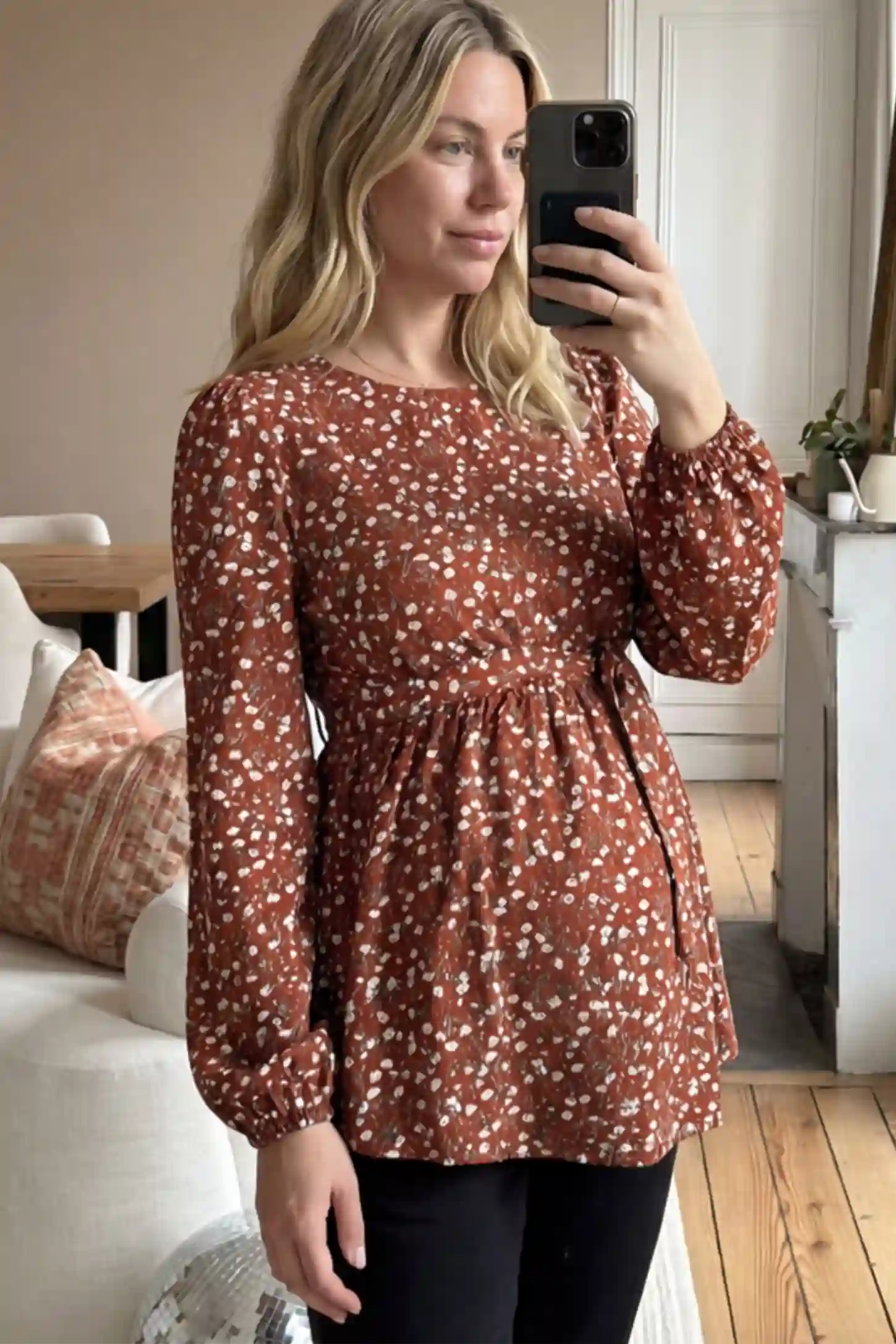 Floral Round Neck Babydoll Maternity Top Floral Round Neck Babydoll Maternity Top in Red featuring an adjustable waist tie on a pregnant model.