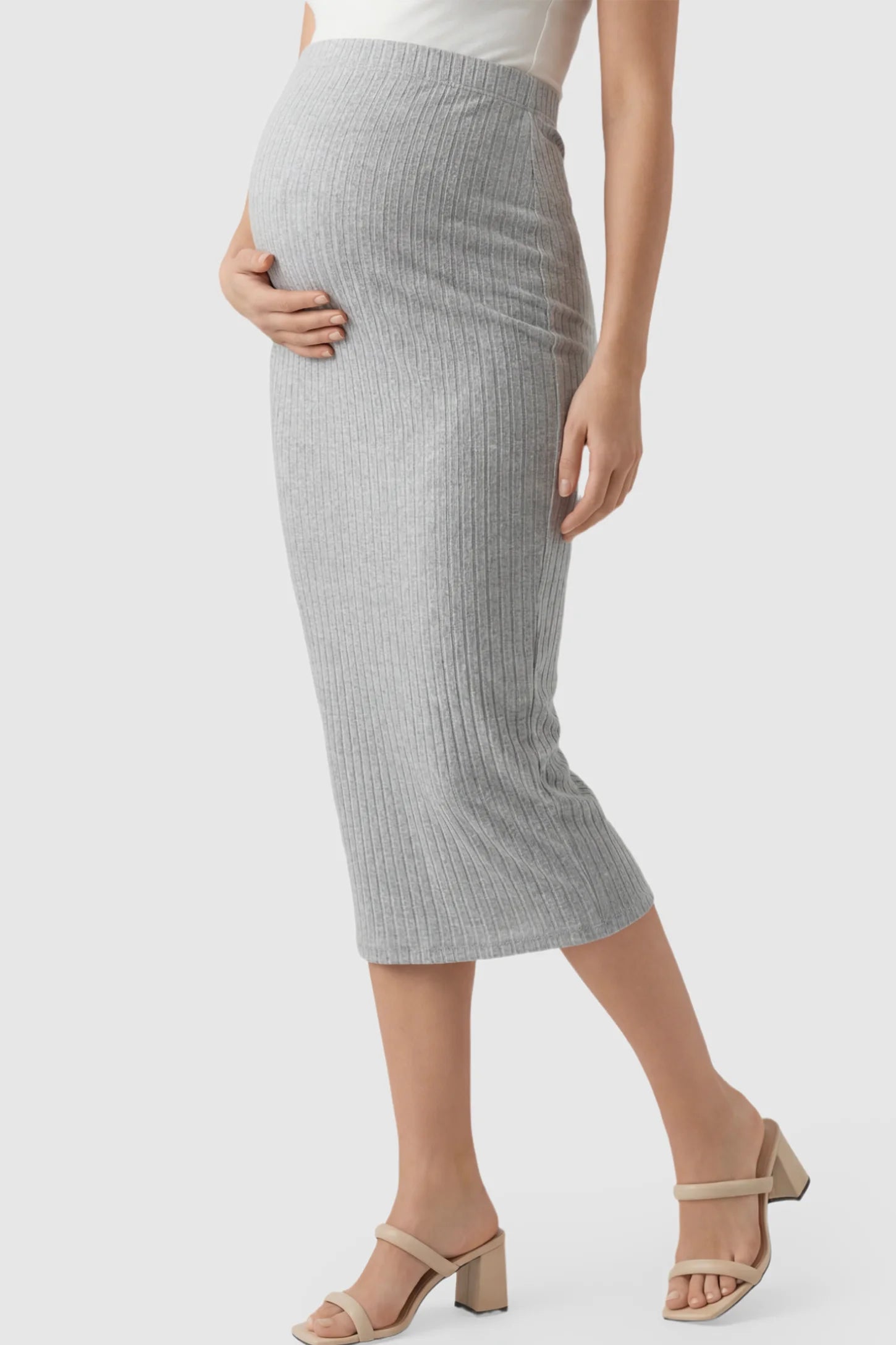 Ribbed Knit High Waist Maternity Skirt Ribbed Knit High Waist Maternity Skirt in Gray featuring a vertical ribbed texture on a pregnant model showing side.