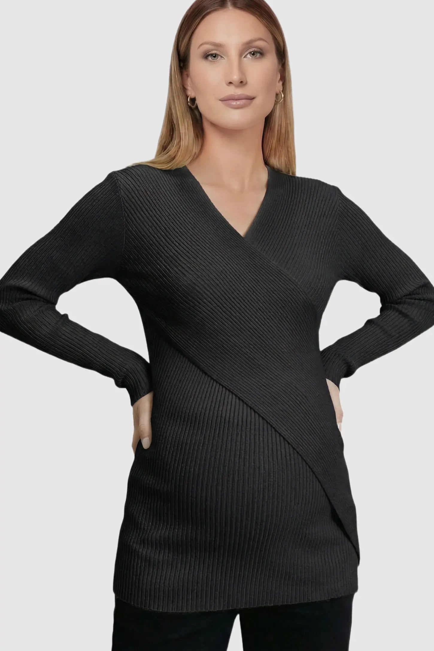 Cross-Over Ribbed Knit Maternity & Nursing Top Cross-Over Ribbed Knit Maternity & Nursing Top in Black featuring a wrap neckline and textured finish on a pregnant model.