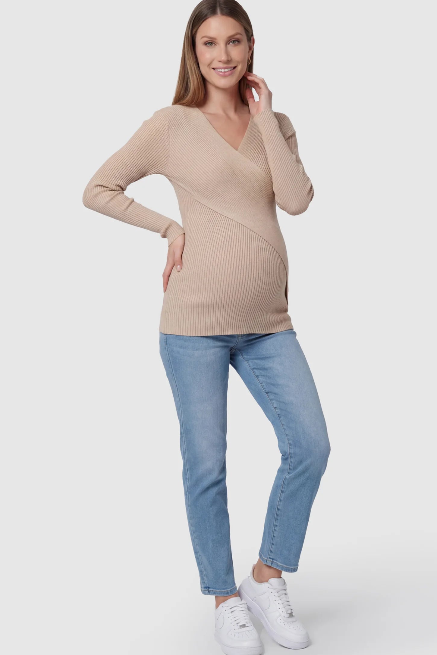 Cross-Over Ribbed Knit Maternity & Nursing Top Cross-Over Ribbed Knit Maternity & Nursing Top in Khaki featuring a wrap neckline and textured finish on a pregnant model.