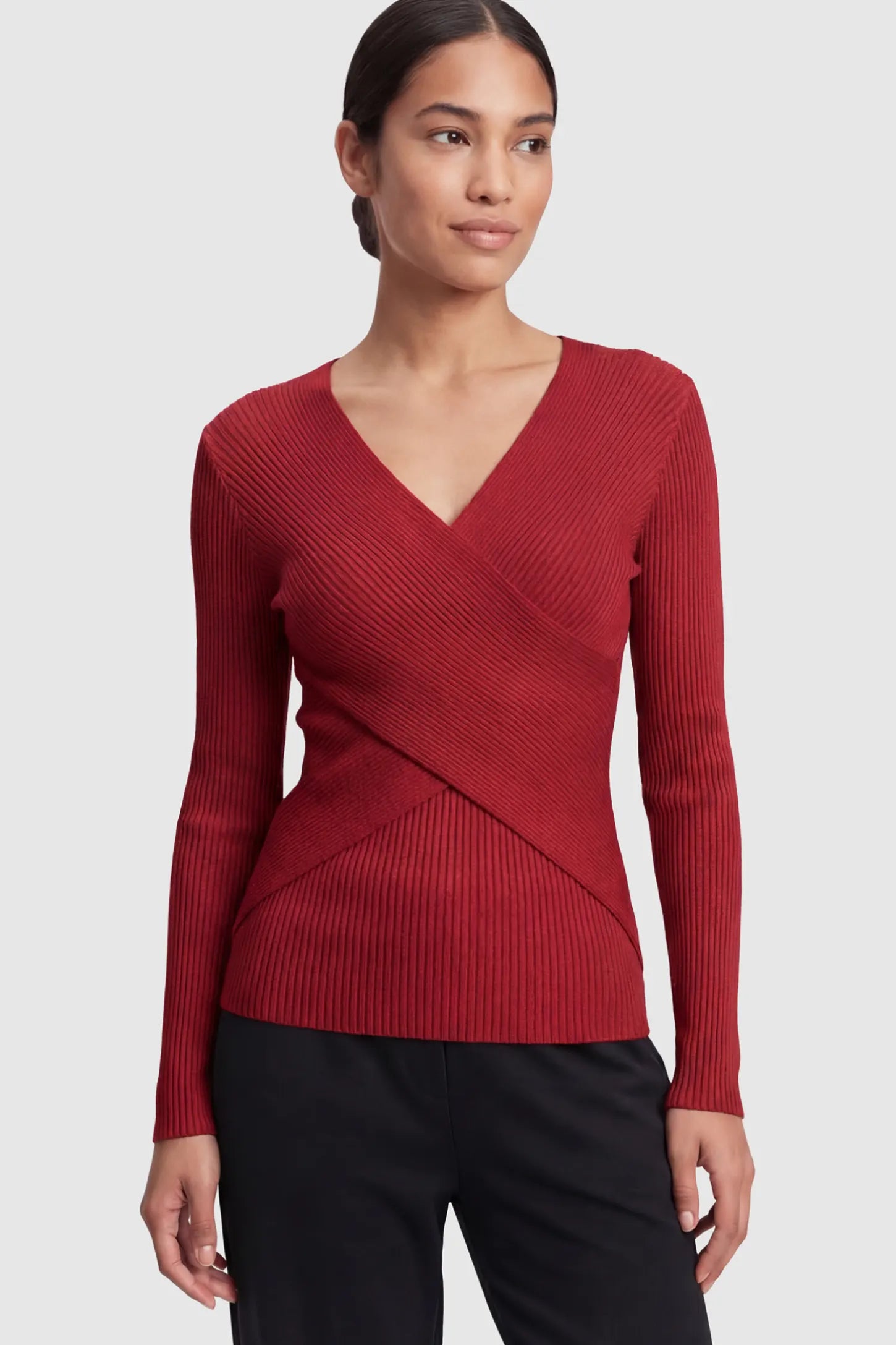 Cross-Over Ribbed Knit Maternity & Nursing Top Cross-Over Ribbed Knit Maternity & Nursing Top in Red featuring a wrap neckline and textured finish on a non-pregnant model.