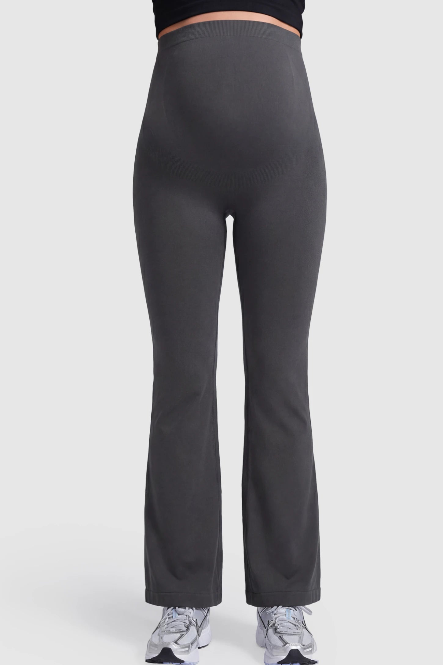 High Waisted Flare Leg Maternity Pants in gray featuring a flexible over-the-belly support band on a pregnant model.
