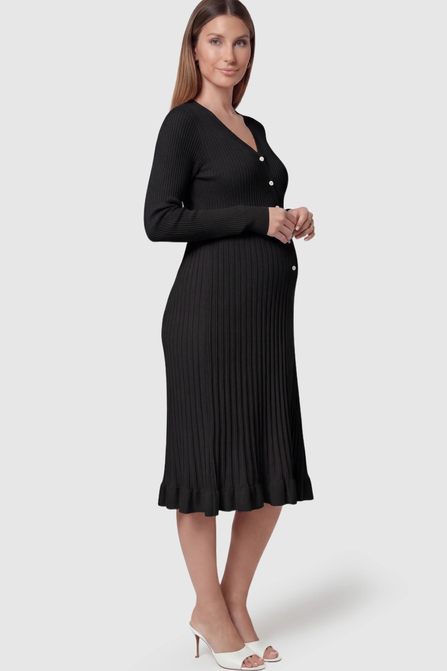 Ribbed V-Neck Maternity Midi Sweater Dress Ribbed V-Neck Maternity Midi Sweater Dress in Black featuring rhinestone buttons on a pregnant model.