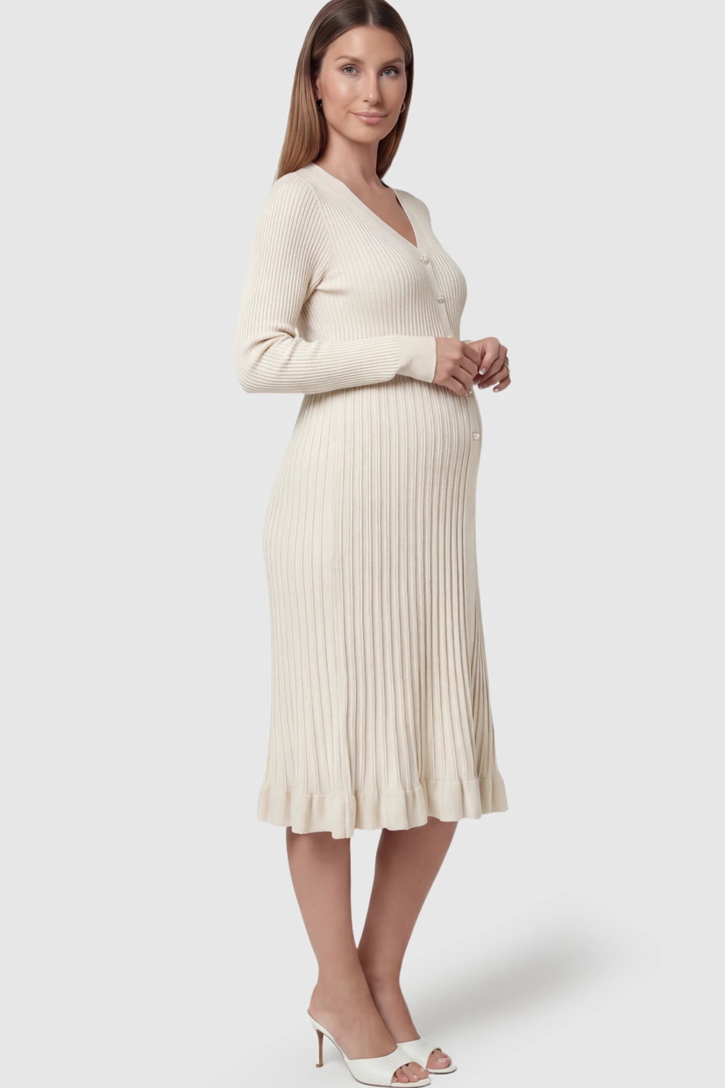 Ribbed V-Neck Maternity Midi Sweater Dress Ribbed V-Neck Maternity Midi Sweater Dress in White featuring rhinestone buttons on a pregnant model.