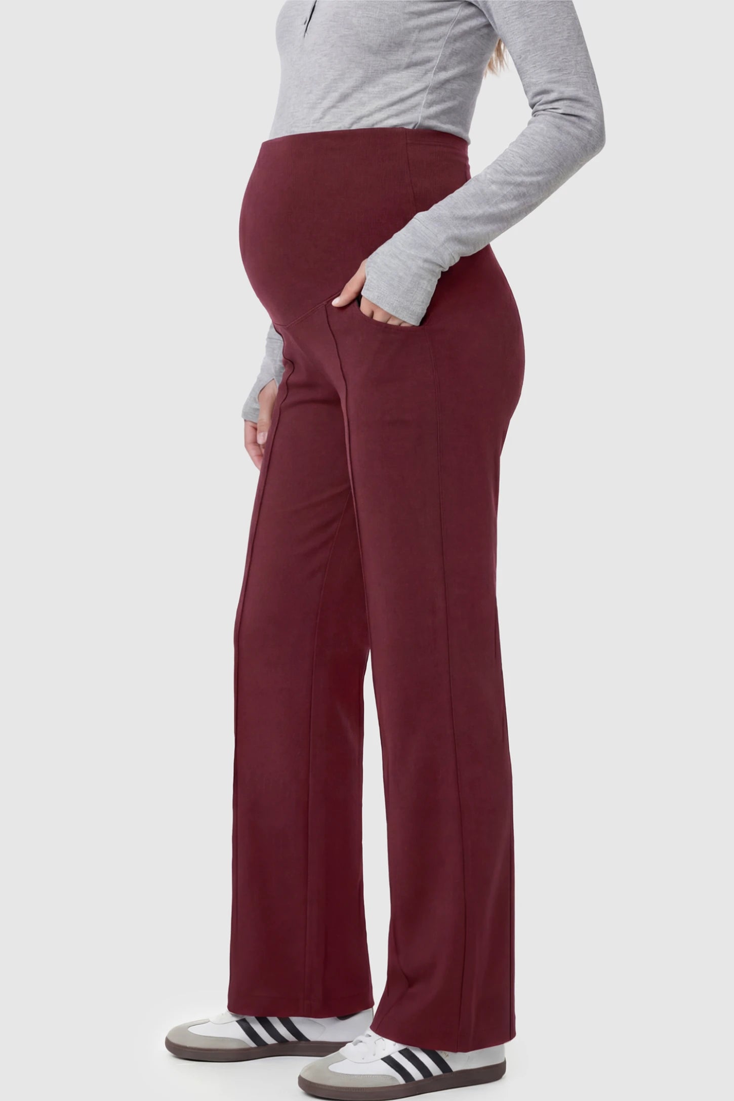 High Stretch Wide Leg Pocketed Maternity Pants High-Stretch Wide Leg Pocketed Maternity Pants in Burgundy featuring a seamless over-the-bump panel and side pocket on a pregnant model.