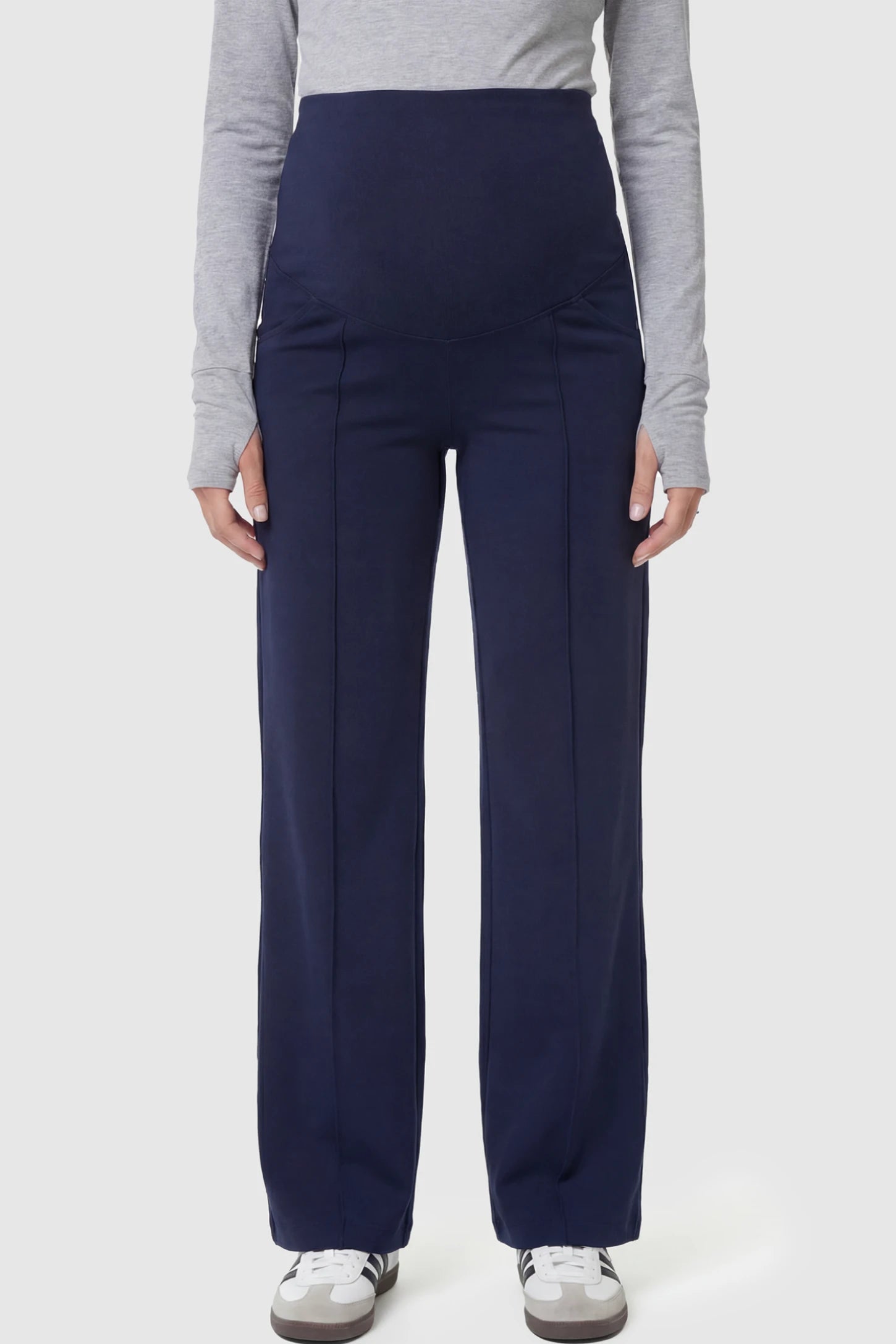 High Stretch Wide Leg Pocketed Maternity Pants High-Stretch Wide Leg Pocketed Maternity Pants in Navvy Blue featuring a seamless over-the-bump panel and side pocket on a pregnant model.
