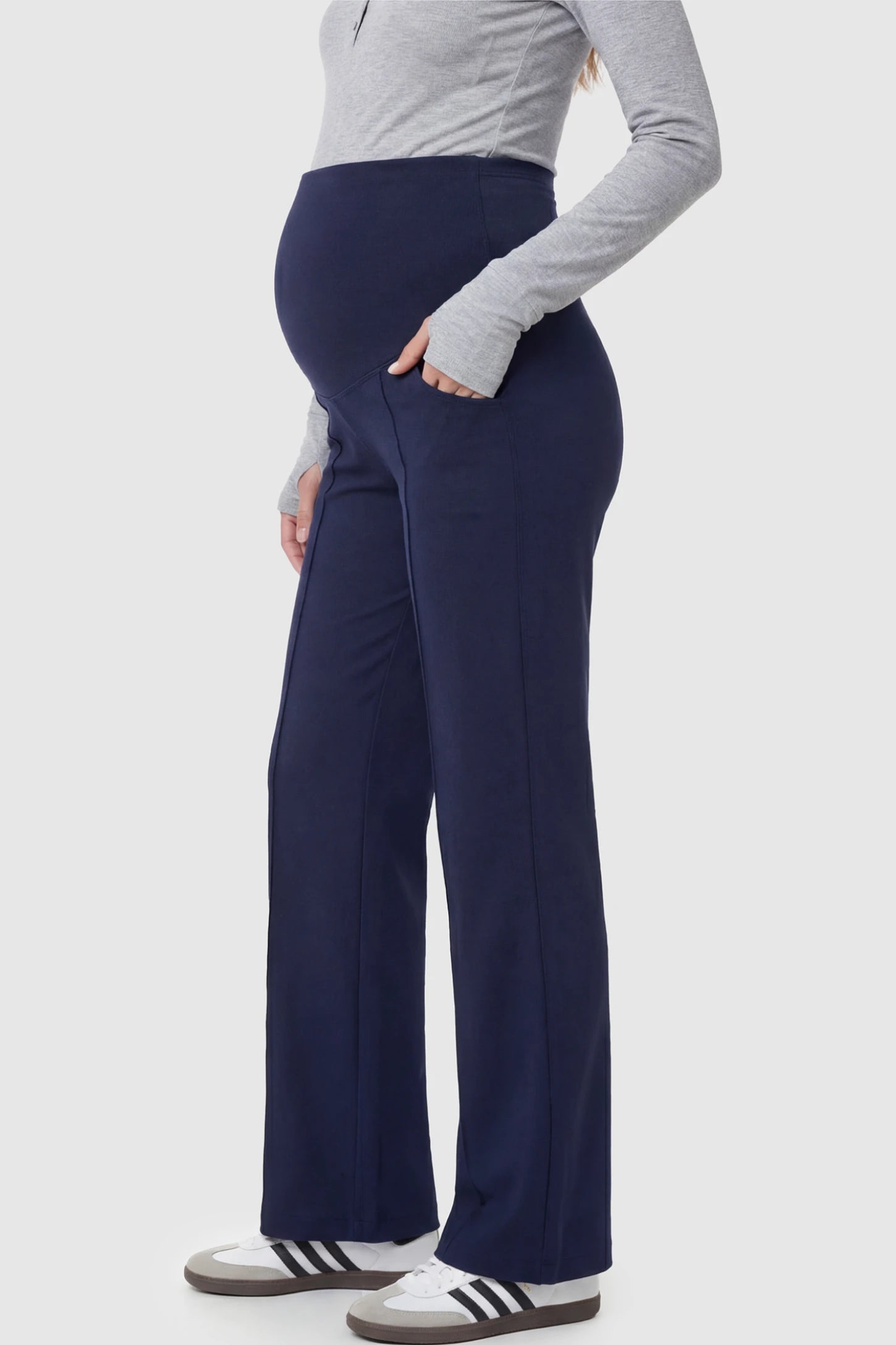 High Stretch Wide Leg Pocketed Maternity Pants High-Stretch Wide Leg Pocketed Maternity Pants in Navvy Blue featuring a seamless over-the-bump panel and side pocket on a pregnant model.