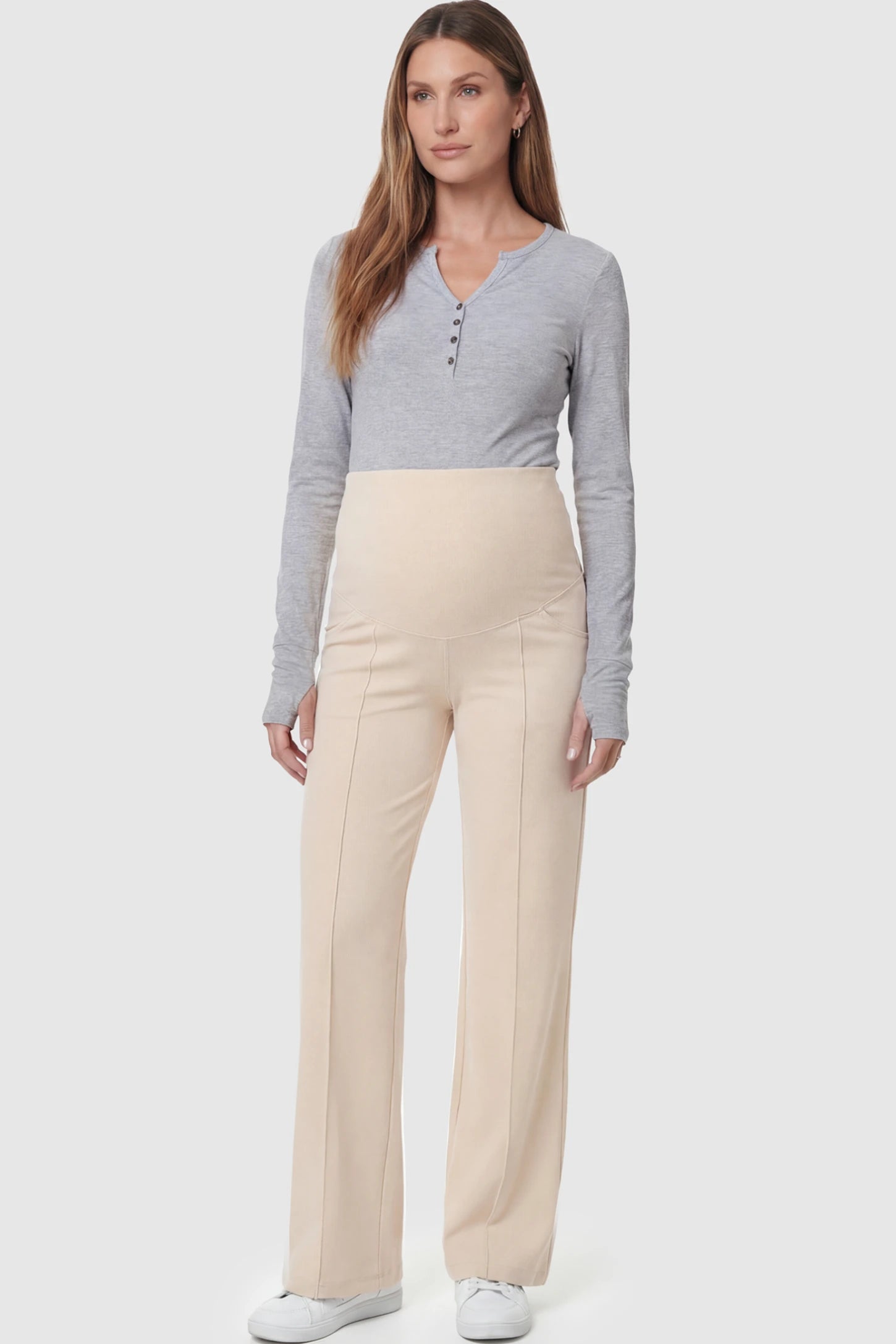 High Stretch Wide Leg Pocketed Maternity Pants High-Stretch Wide Leg Pocketed Maternity Pants in Off White featuring a seamless over-the-bump panel and side pockets on a pregnant model.
