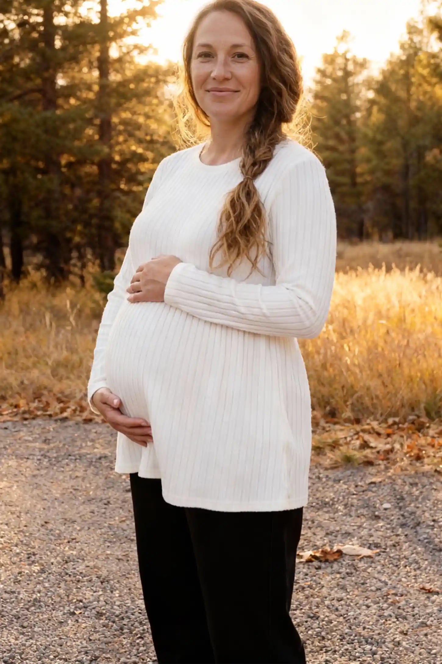 Ribbed Knit Long Sleeve Maternity Top Ribbed Knit Long Sleeve Maternity Top in White featuring an empire waist and high-stretch fabric on a pregnant model.