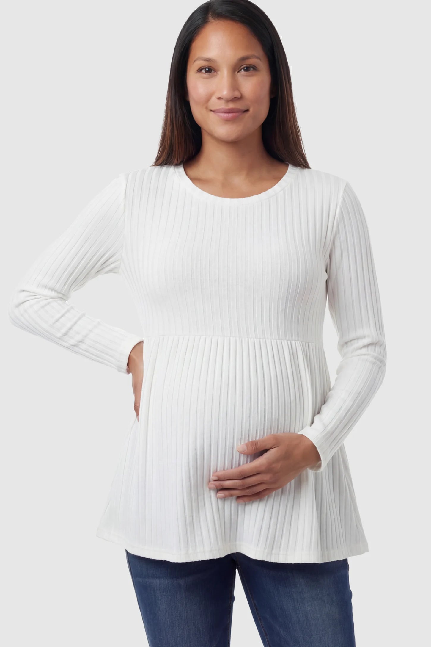 Ribbed Knit Long Sleeve Maternity Top Ribbed Knit Long Sleeve Maternity Top in White featuring an empire waist and high-stretch fabric on a pregnant model.