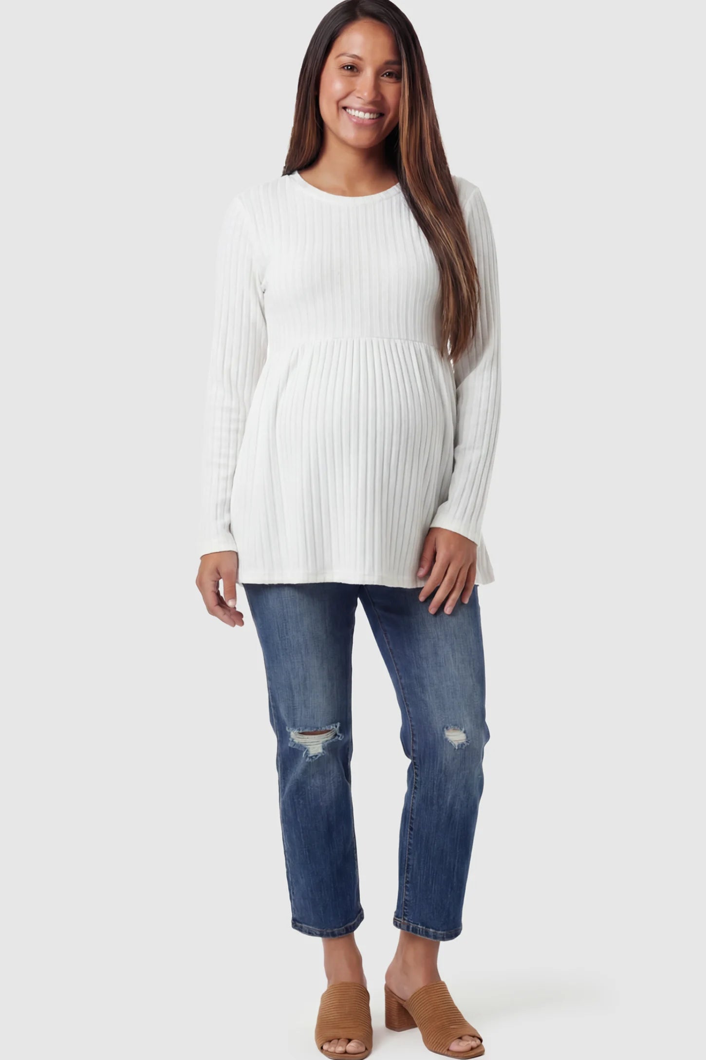 Ribbed Knit Long Sleeve Maternity Top Ribbed Knit Long Sleeve Maternity Top in White featuring an empire waist and high-stretch fabric on a pregnant model.