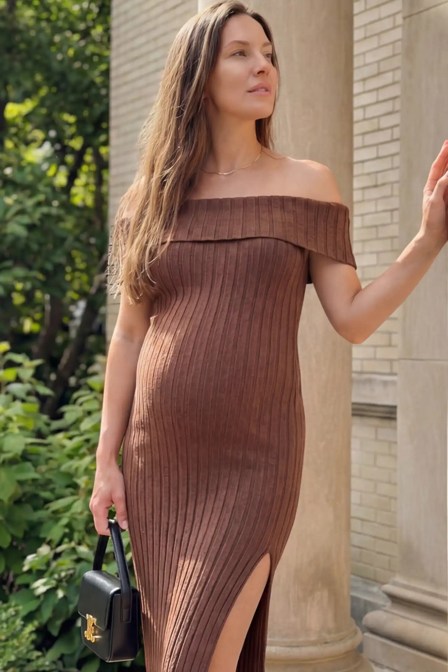 Ribbed Knit Off Shoulder Side Slit Maternity Midi Dress Ribbed Knit Side Slit Off Shoulder Maternity Midi Dress in Brown featuring a fold-over neckline on a pregnant model.