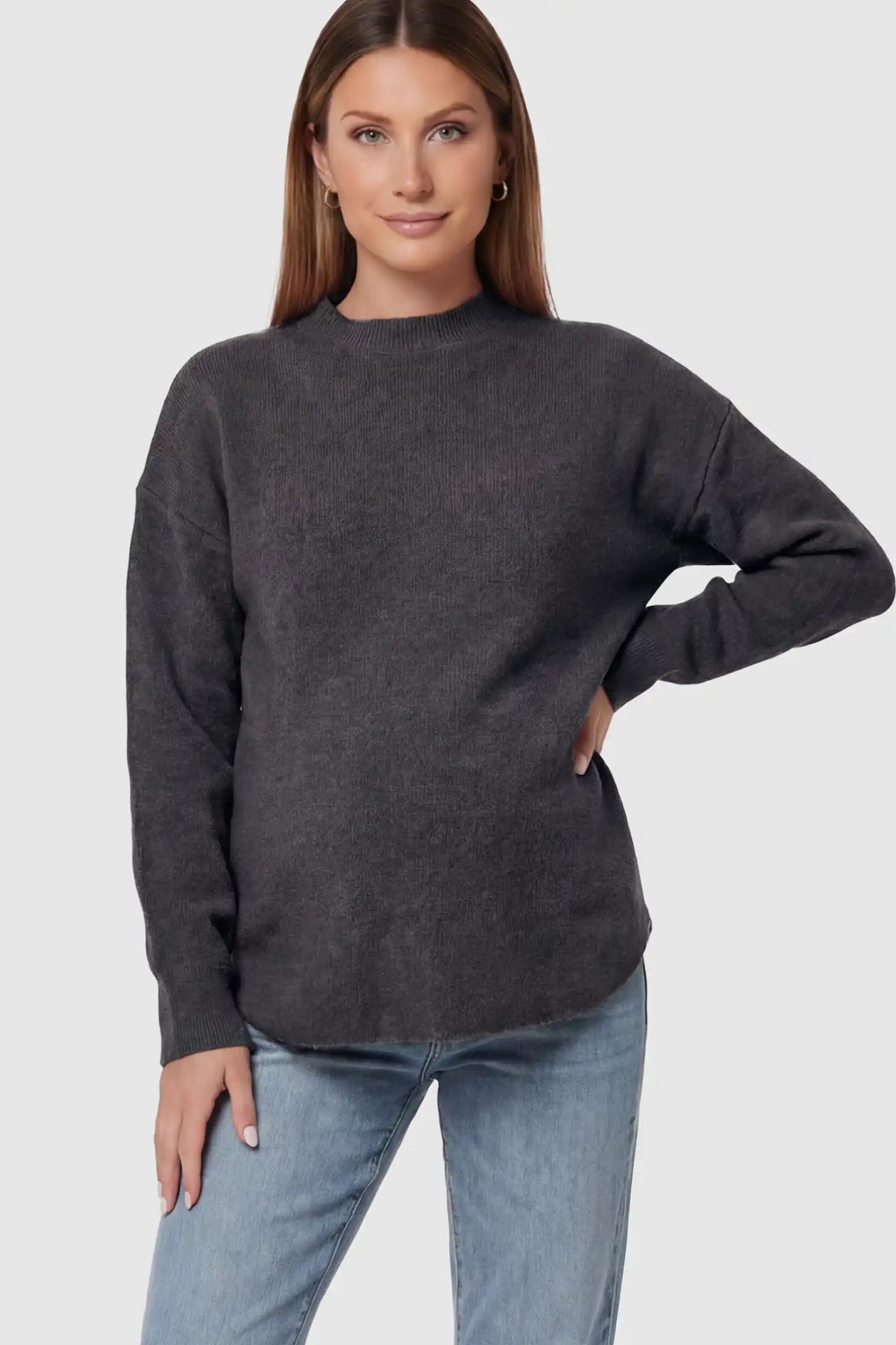 Mock Neck Long Sleeve Maternity Sweater Mock Neck Long Sleeve Maternity Sweater in Black thickened woolen fabric on a pregnant model.