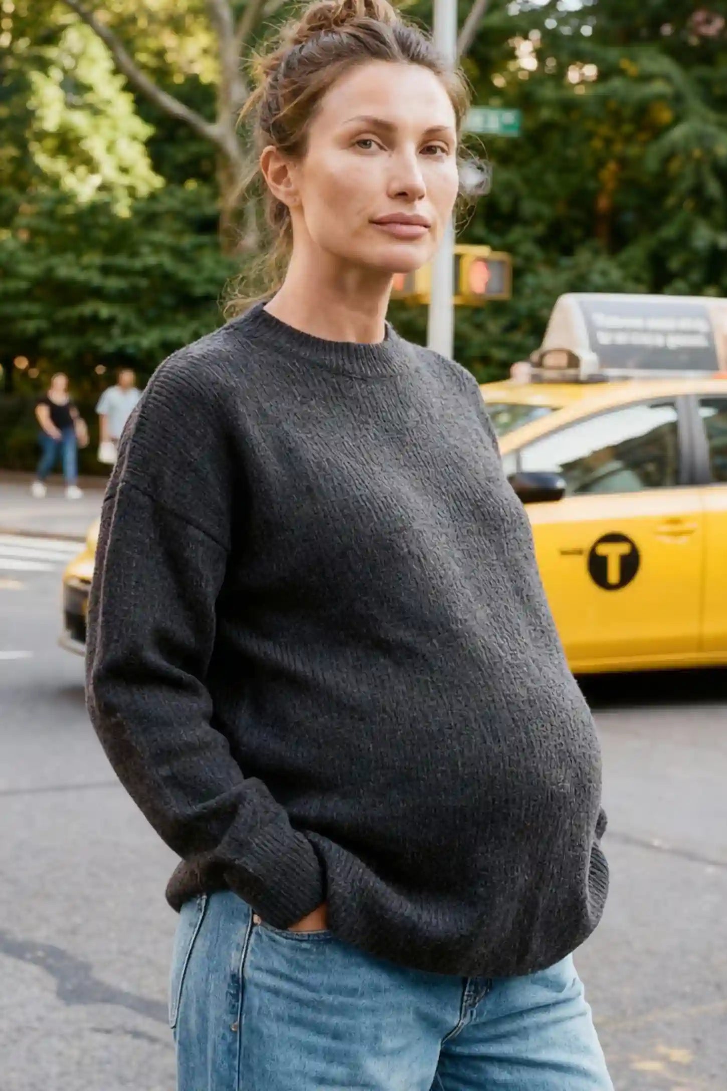 Mock Neck Long Sleeve Maternity Sweater Mock Neck Long Sleeve Maternity Sweater in Black thickened woolen fabric on a pregnant model.