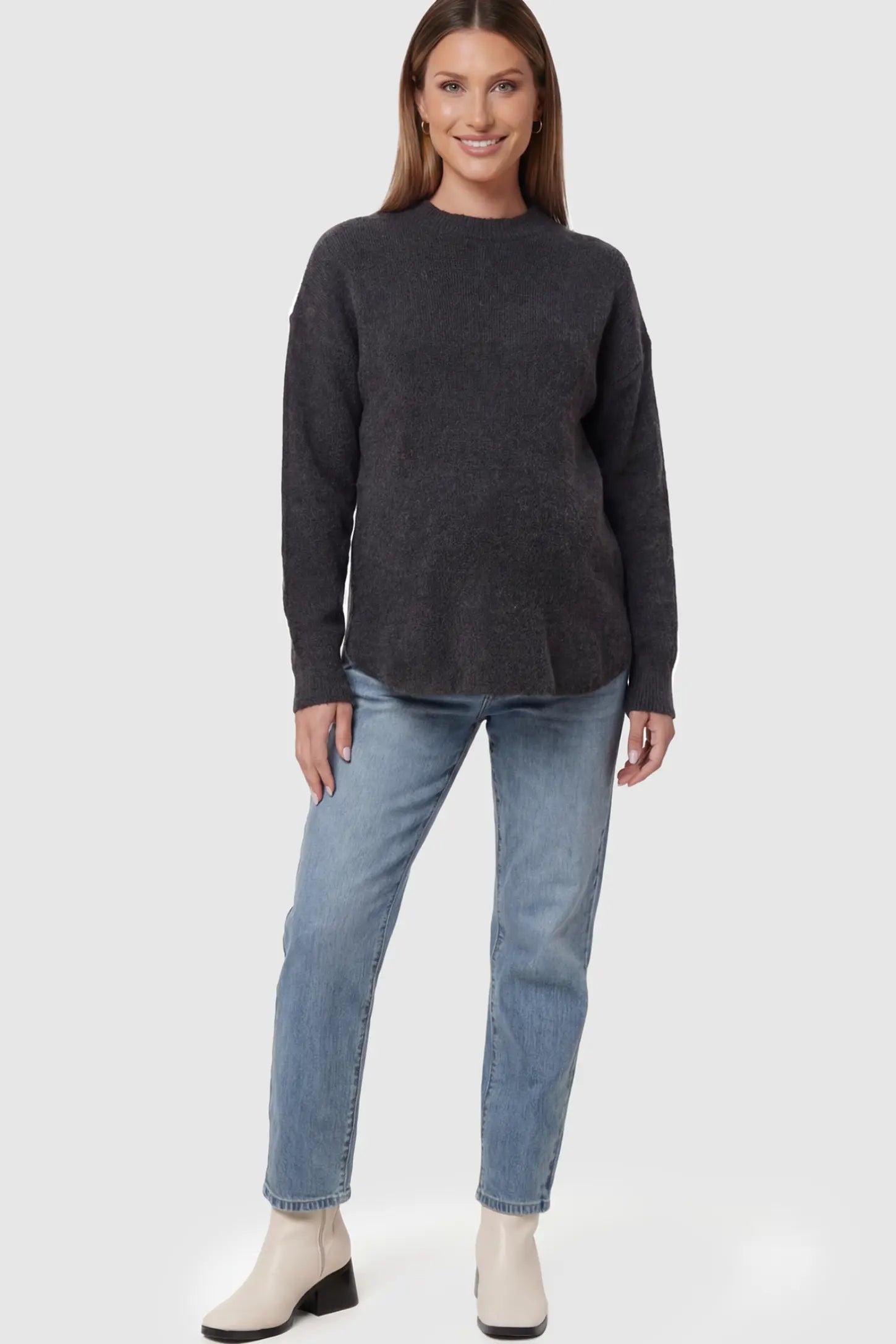 Mock Neck Long Sleeve Maternity Sweater Mock Neck Long Sleeve Maternity Sweater in Black thickened woolen fabric on a pregnant model.