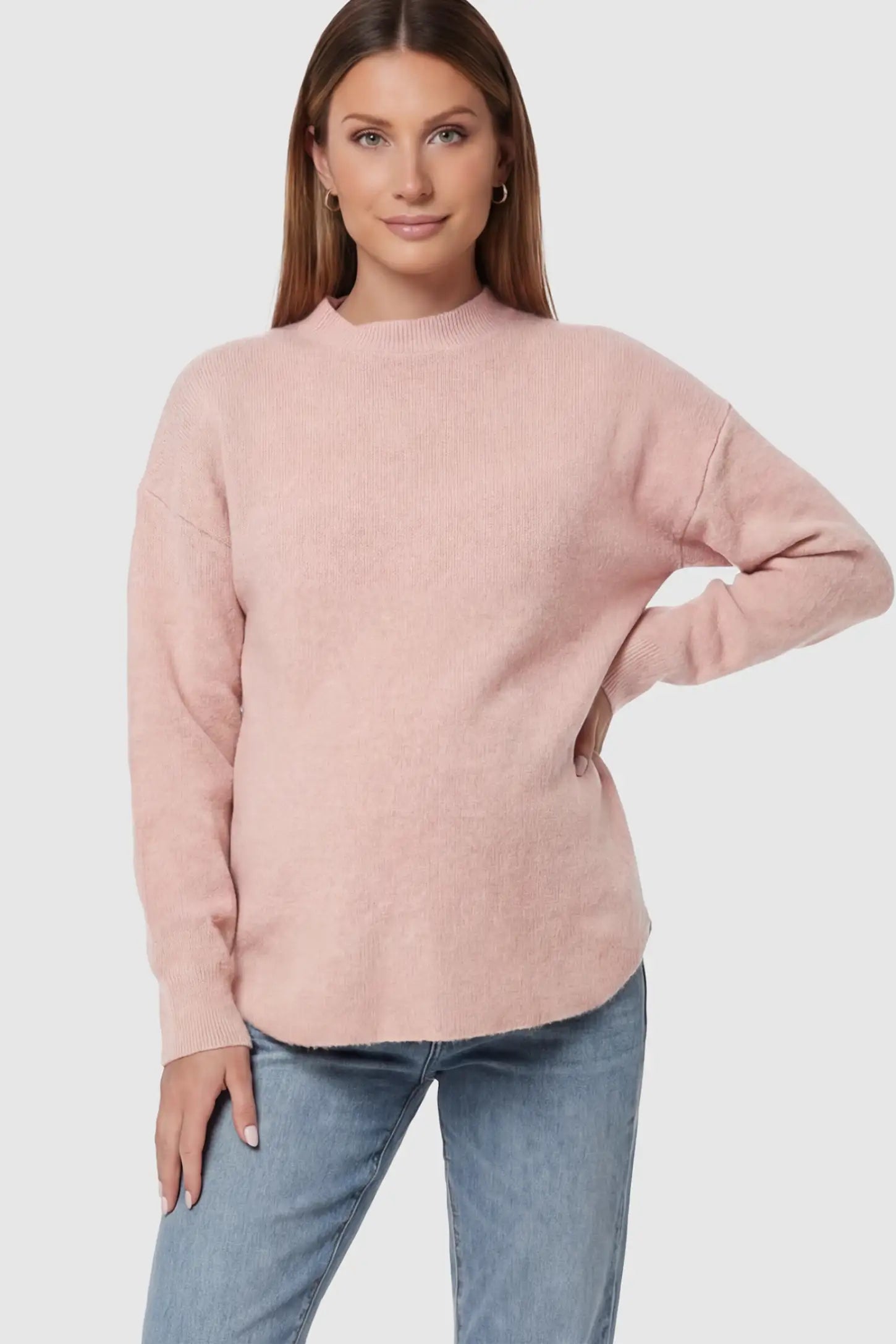 Mock Neck Long Sleeve Maternity Sweater Mock Neck Long Sleeve Maternity Sweater in Pink thickened woolen fabric on a pregnant model.