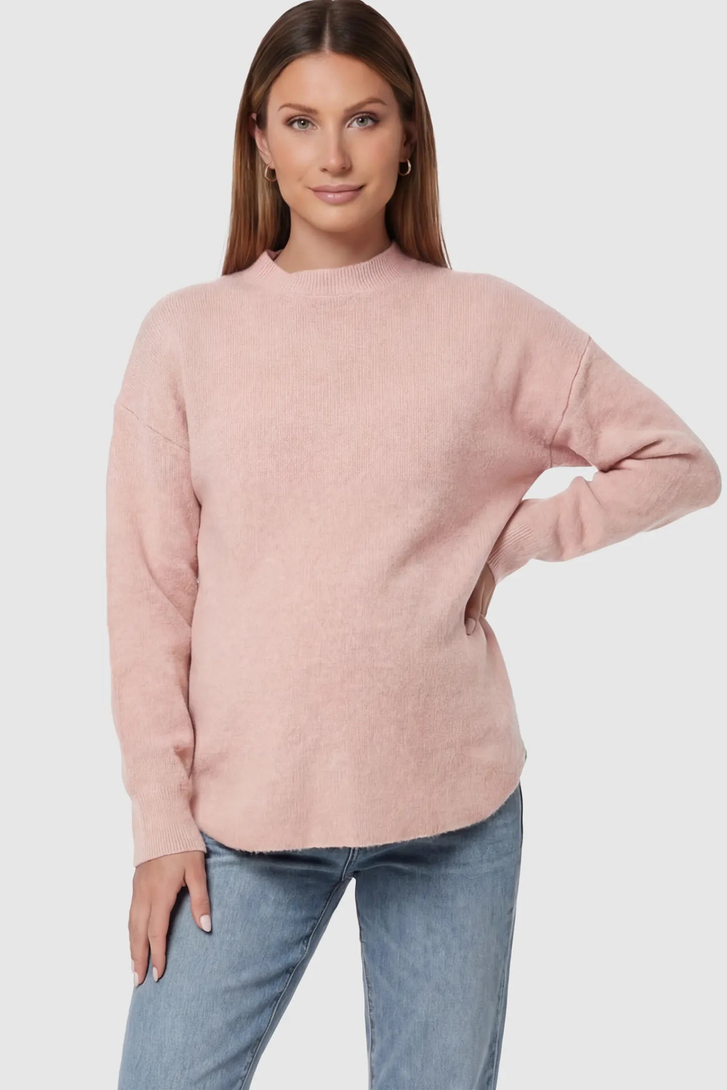 Mock Neck Long Sleeve Maternity Sweater Mock Neck Long Sleeve Maternity Sweater in Pink thickened woolen fabric on a pregnant model.
