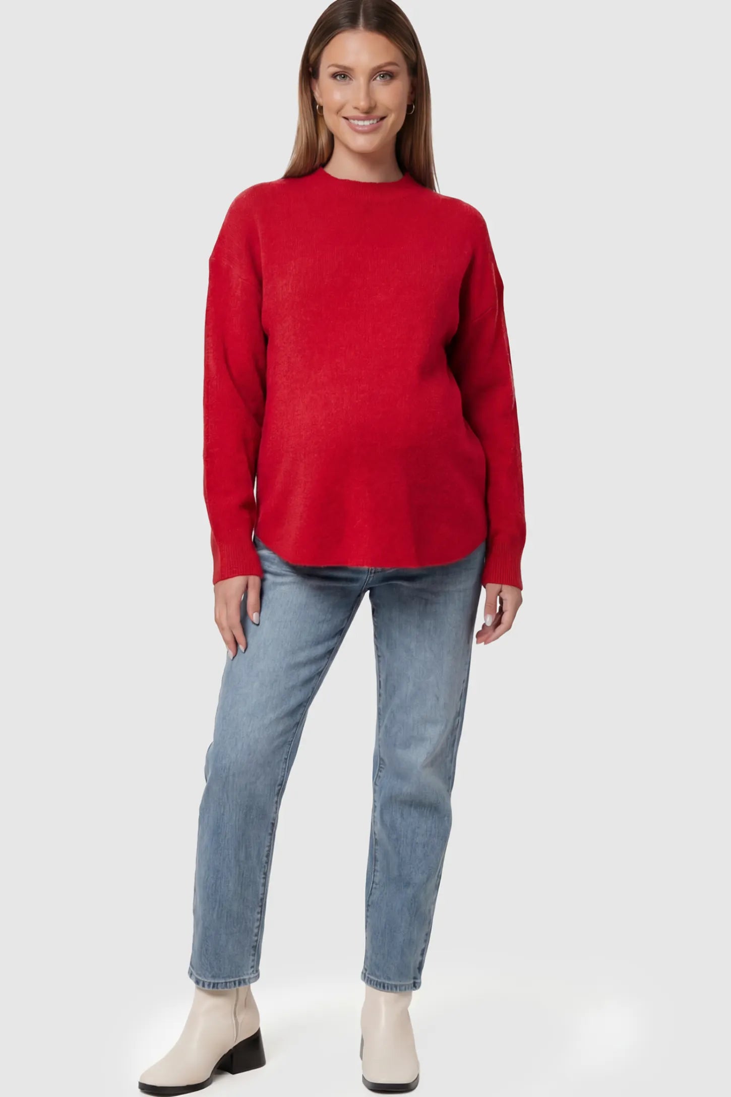 Mock Neck Long Sleeve Maternity Sweater Mock Neck Long Sleeve Maternity Sweater in Red thickened woolen fabric on a pregnant model.