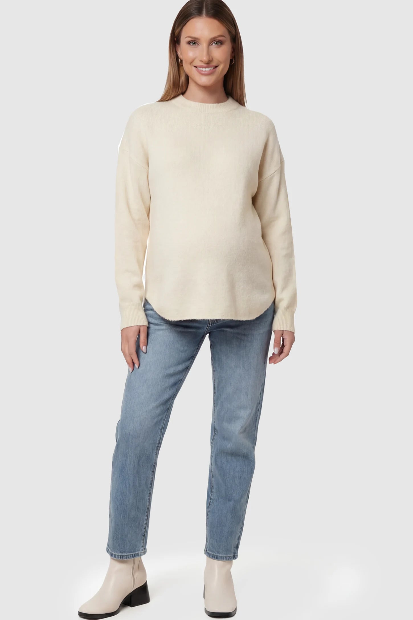 Mock Neck Long Sleeve Maternity Sweater Mock Neck Long Sleeve Maternity Sweater in White thickened woolen fabric on a pregnant model.