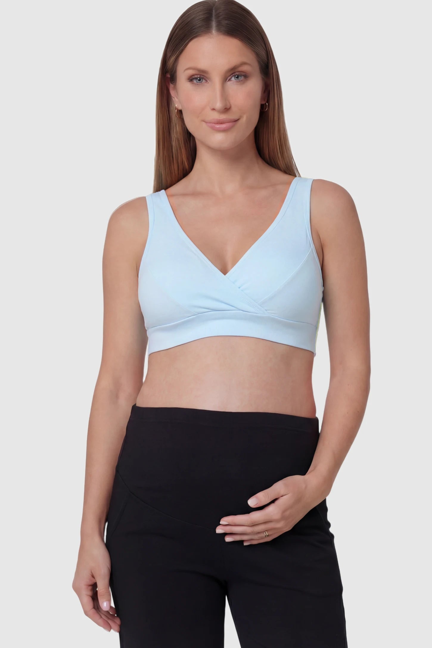 Soft Cotton Crossover Wireless Maternity Nursing Bra Soft Cotton Crossover Wireless Pull-On Maternity Nursing Bra in Blue featuring a wrap-front design on a pregnant model.