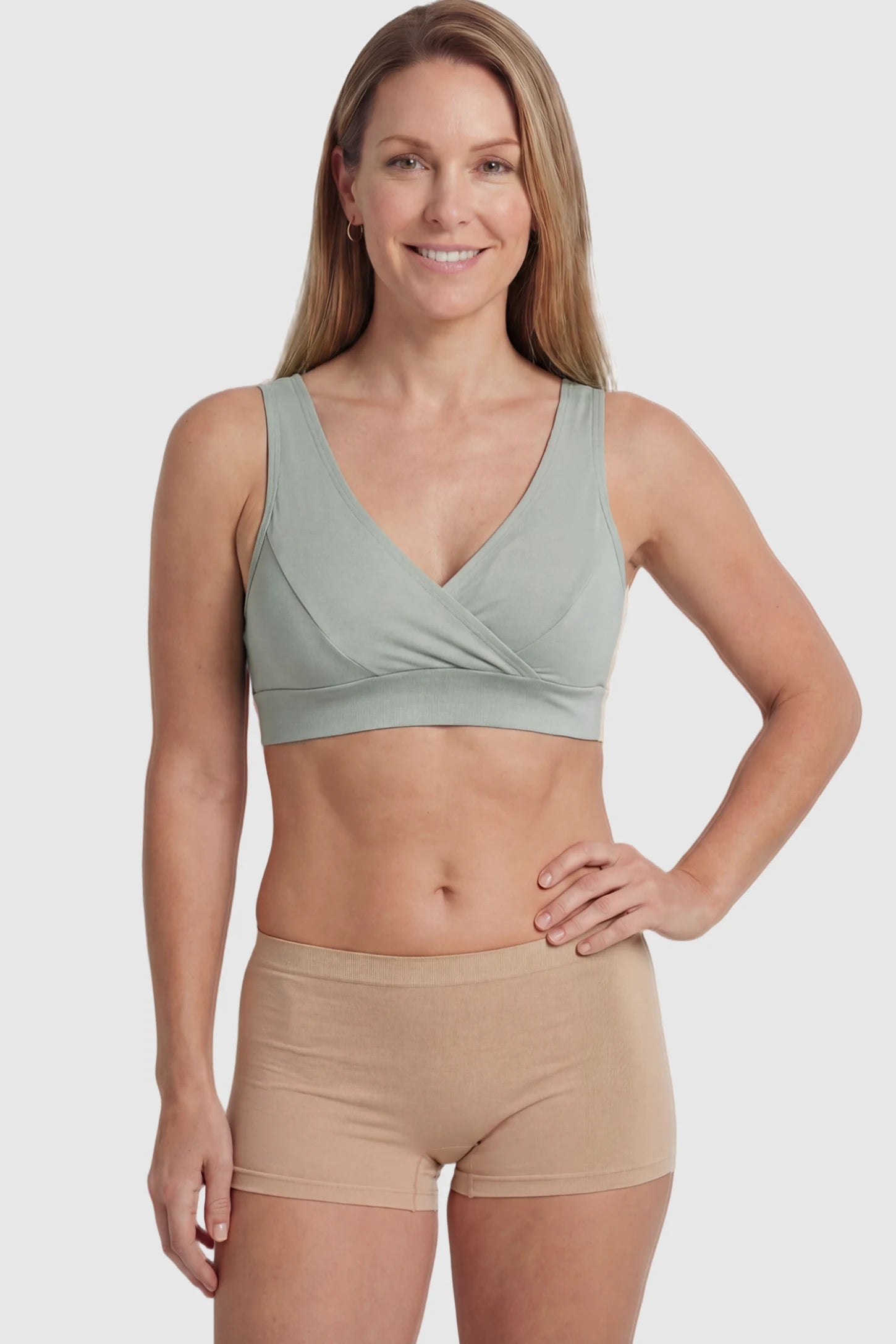 Soft Cotton Crossover Wireless Maternity Nursing Bra Soft Cotton Crossover Wireless Pull-On Maternity Nursing Bra in Gray featuring a wrap-front design on a postpartum model.