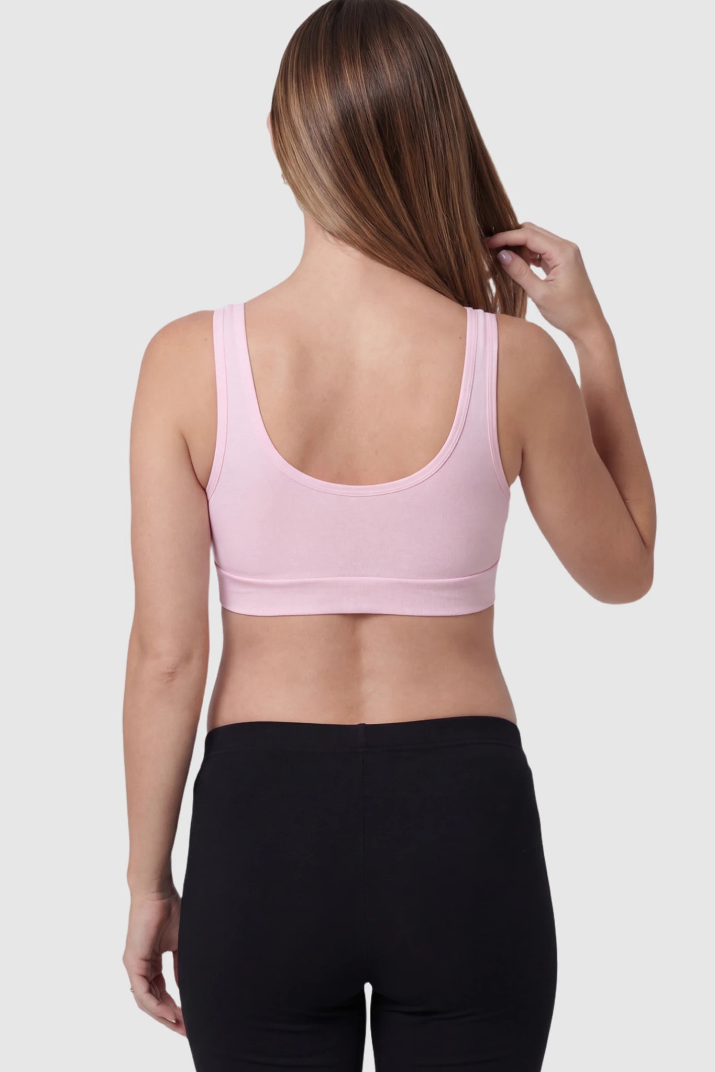 Soft Cotton Crossover Wireless Pull-On Maternity Nursing Bra in Pink on a pregnant model.
