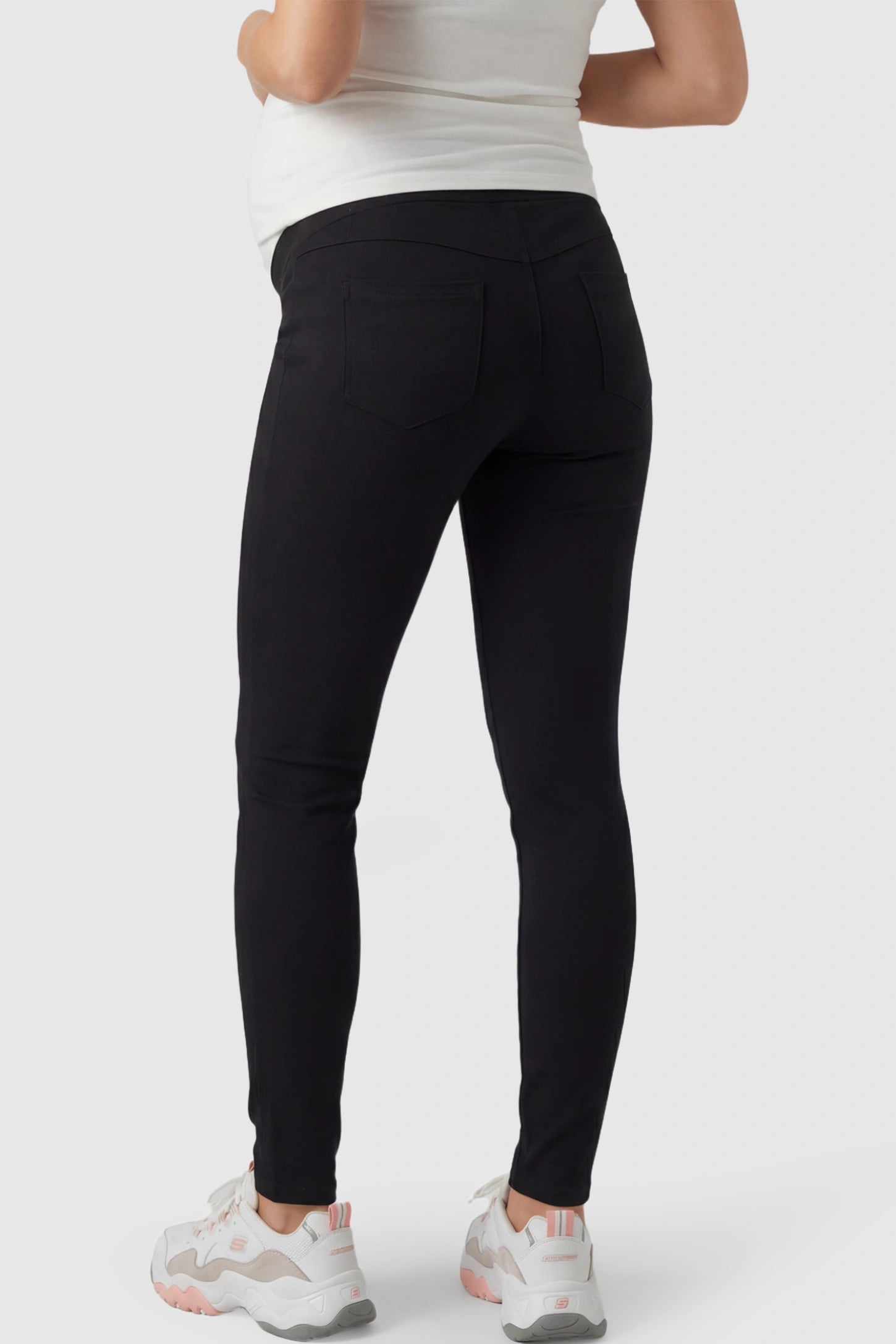 Full Panel Skinny Maternity Pants Full Panel Skinny Maternity Pants in black featuring high stretch viscose and cotton blend on a pregnant model.
