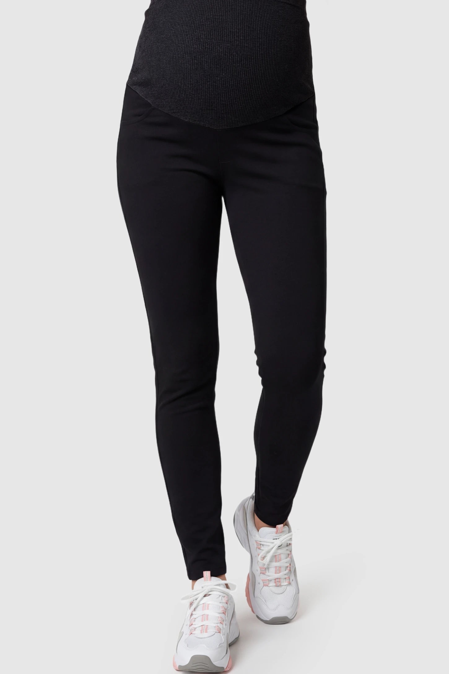 Full Panel Skinny Maternity Pants in black featuring high stretch viscose and cotton blend on a pregnant model.