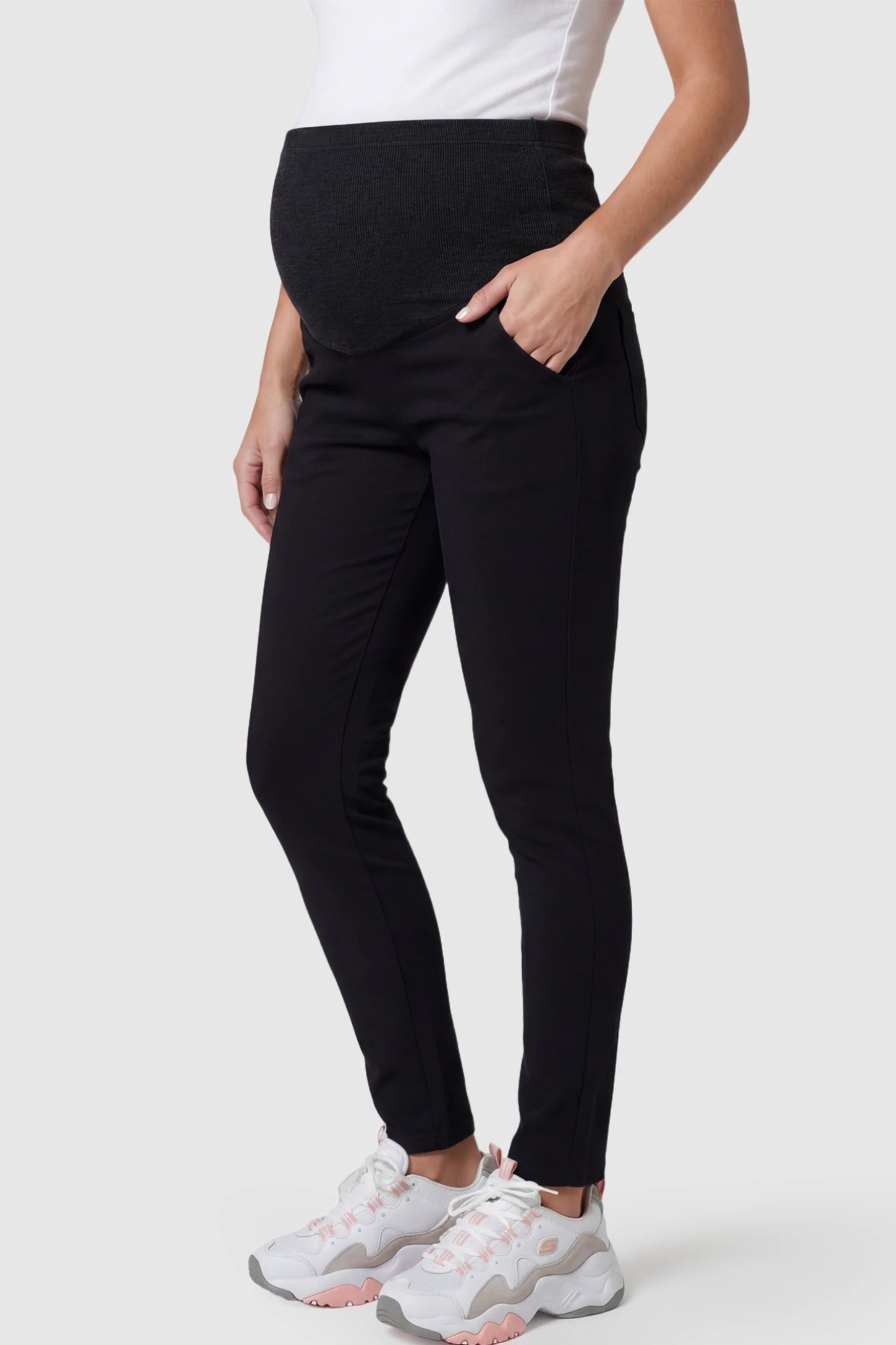 Full Panel Skinny Maternity Pants Full Panel Skinny Maternity Pants in black featuring high stretch viscose and cotton blend on a pregnant model.