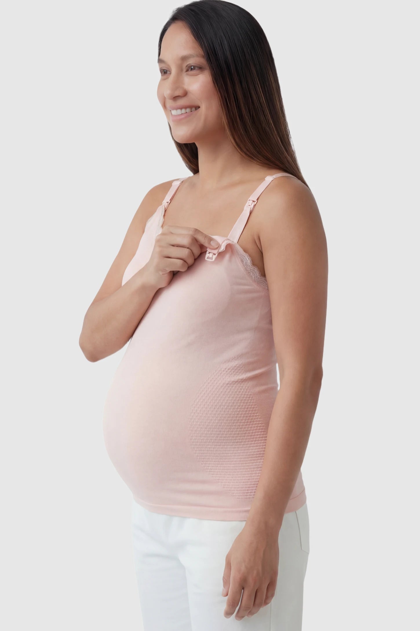 Lace Trim Wire Free Maternity Nursing Camisole in light pink offering one-handed nursing access on a pregnant model.